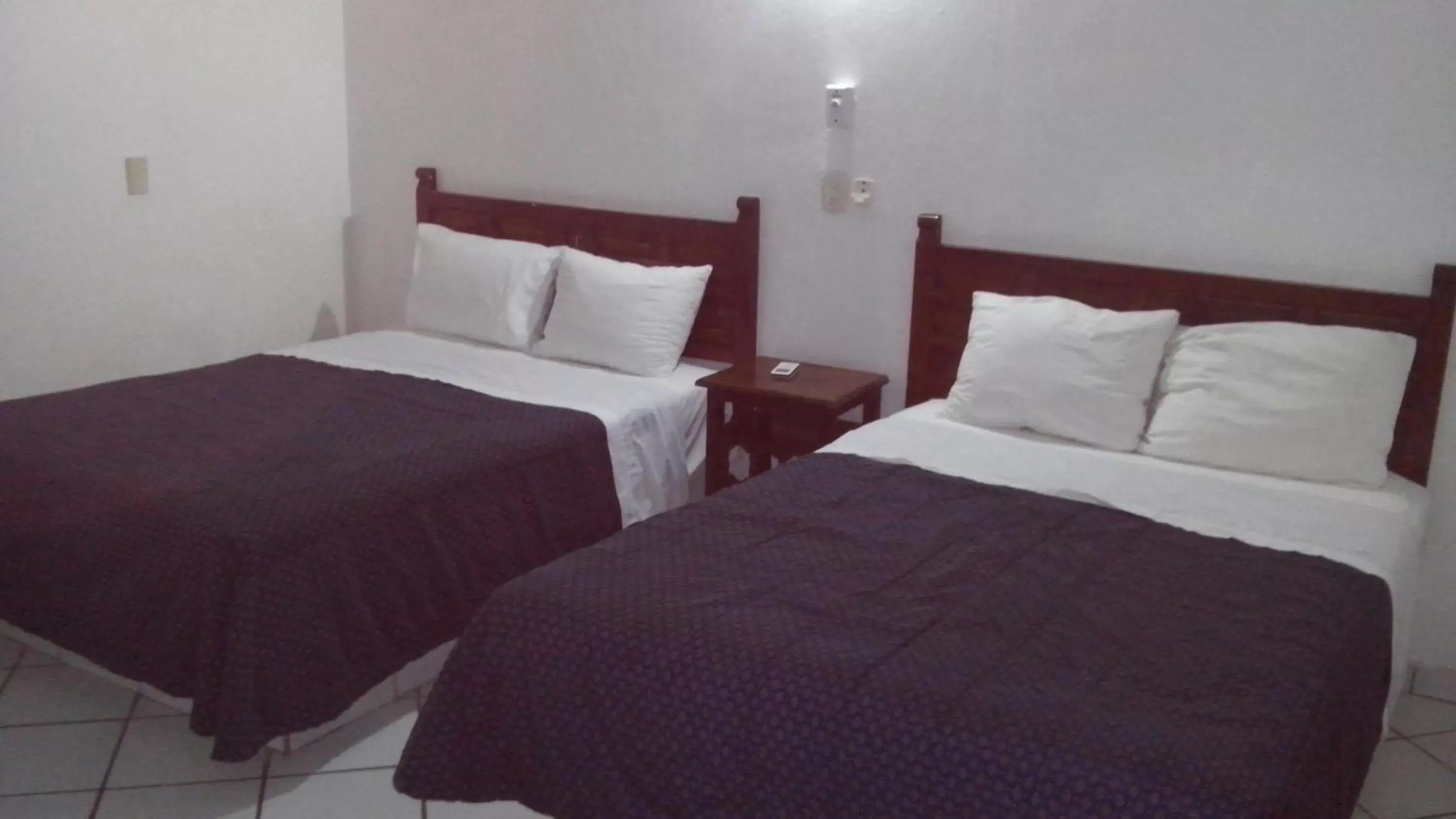 Bed in Costa Alegre Hotel & Suites