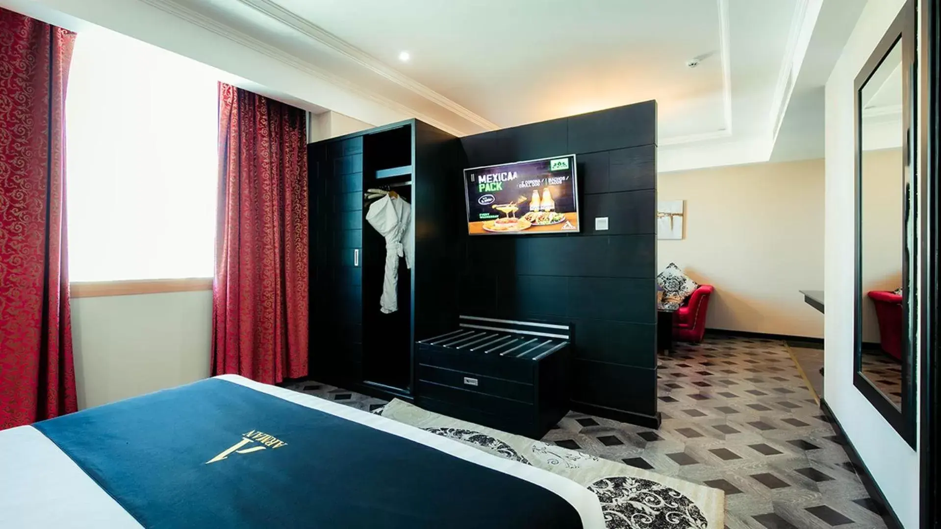 Bed, TV/Entertainment Center in Arman Hotel Juffair Mall