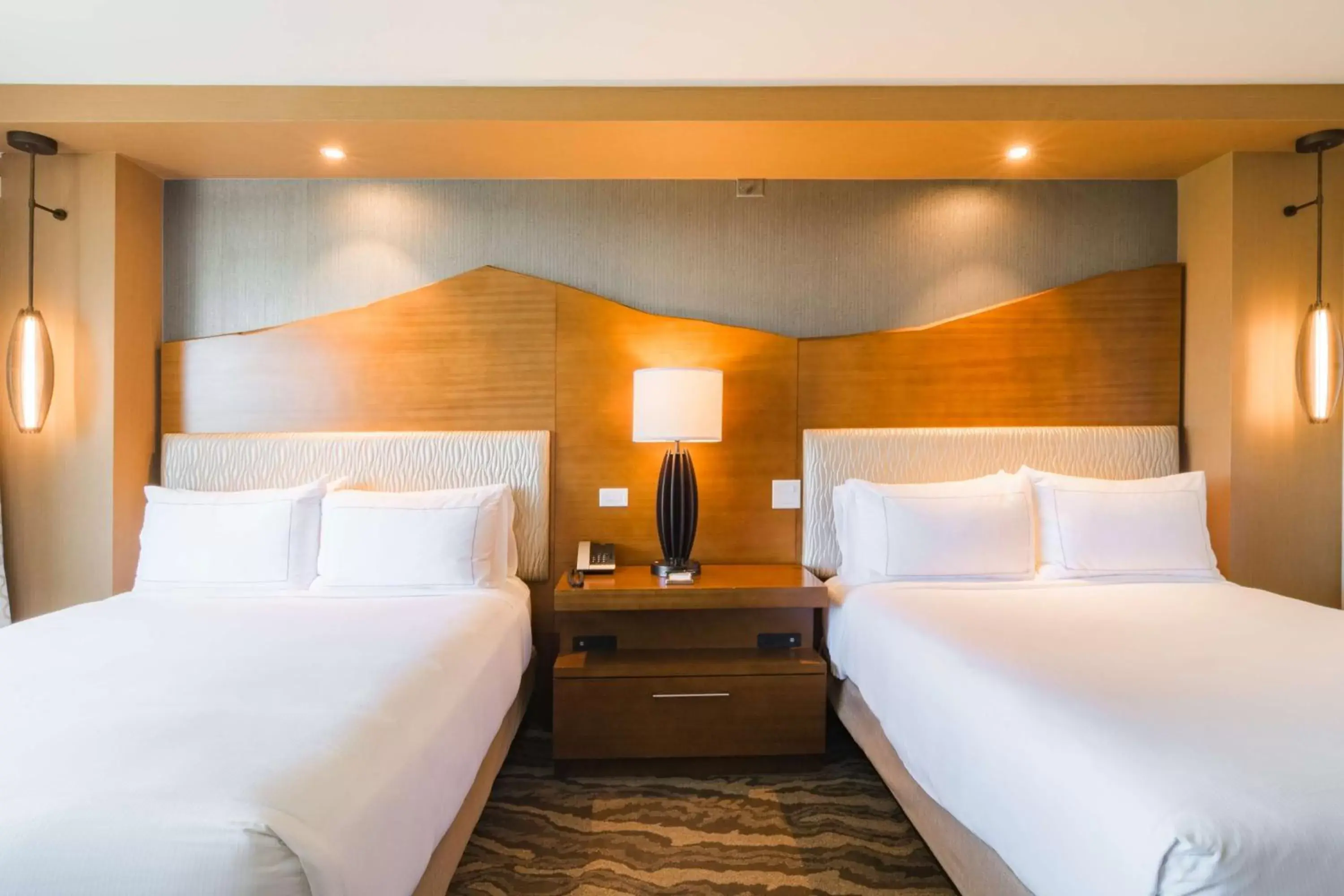 Bed in The Inverness Denver, a Hilton Golf & Spa Resort