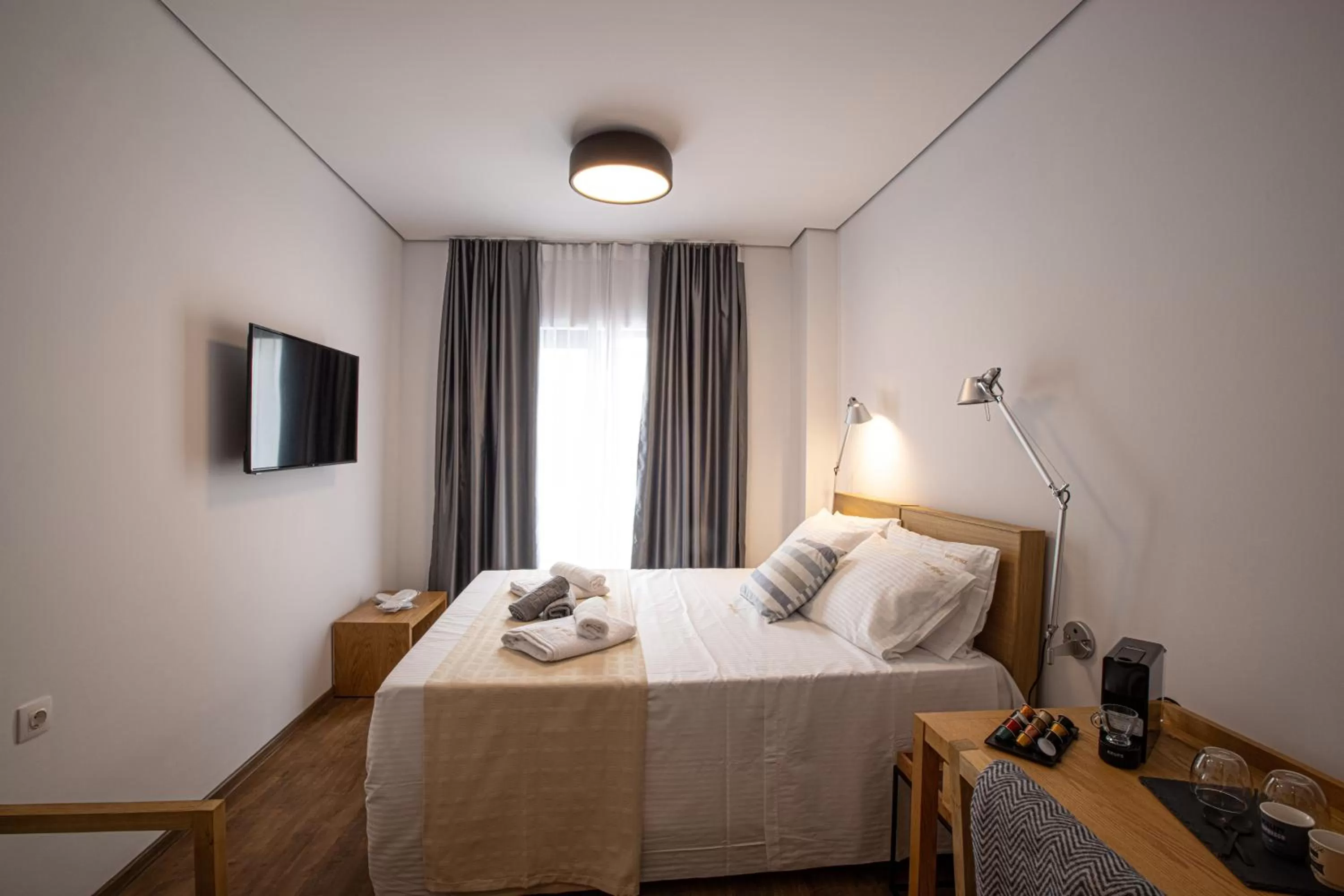 Bed in Saint George Boutique Rooms