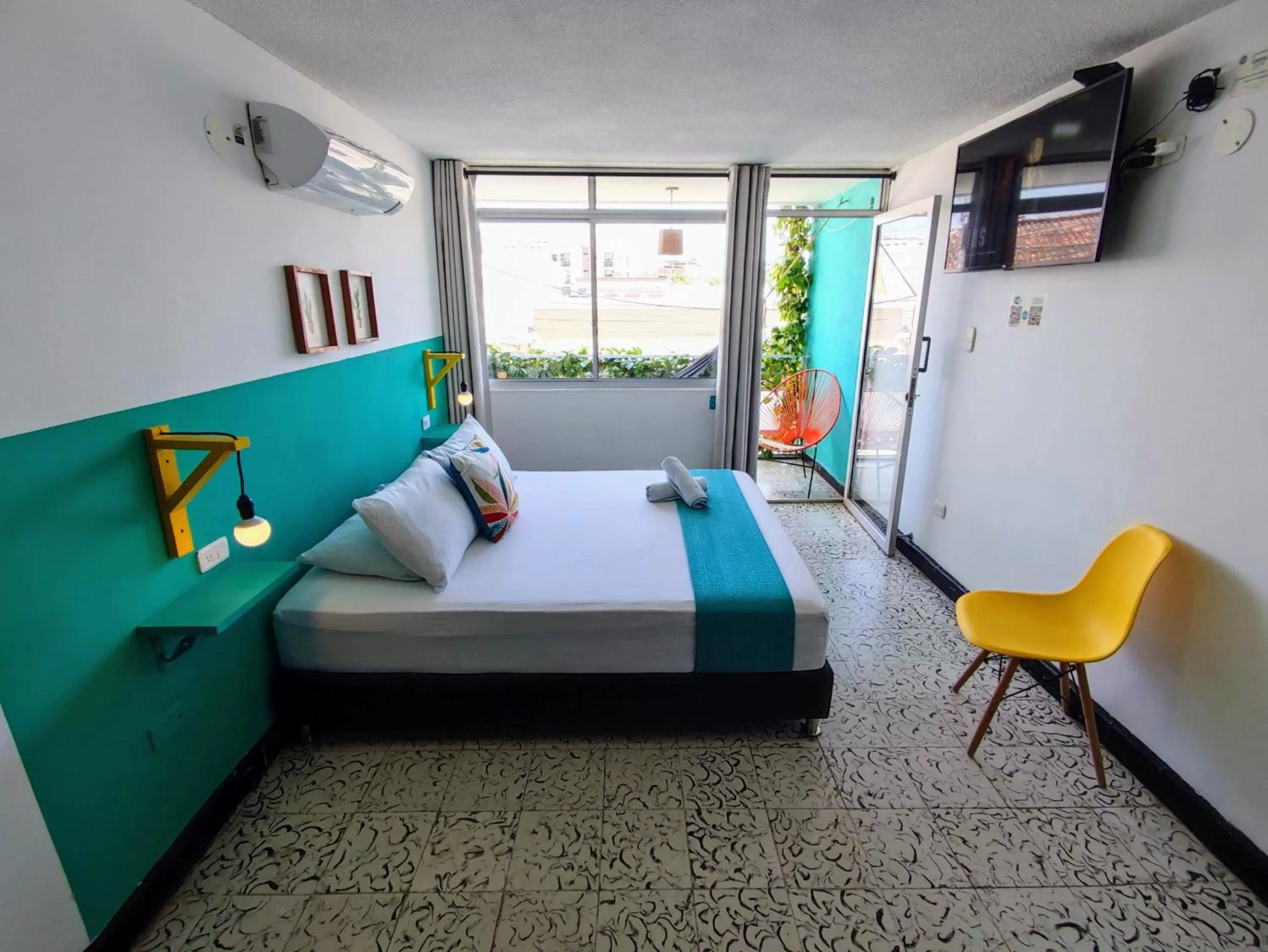 Bed in Bona Vida Hotel