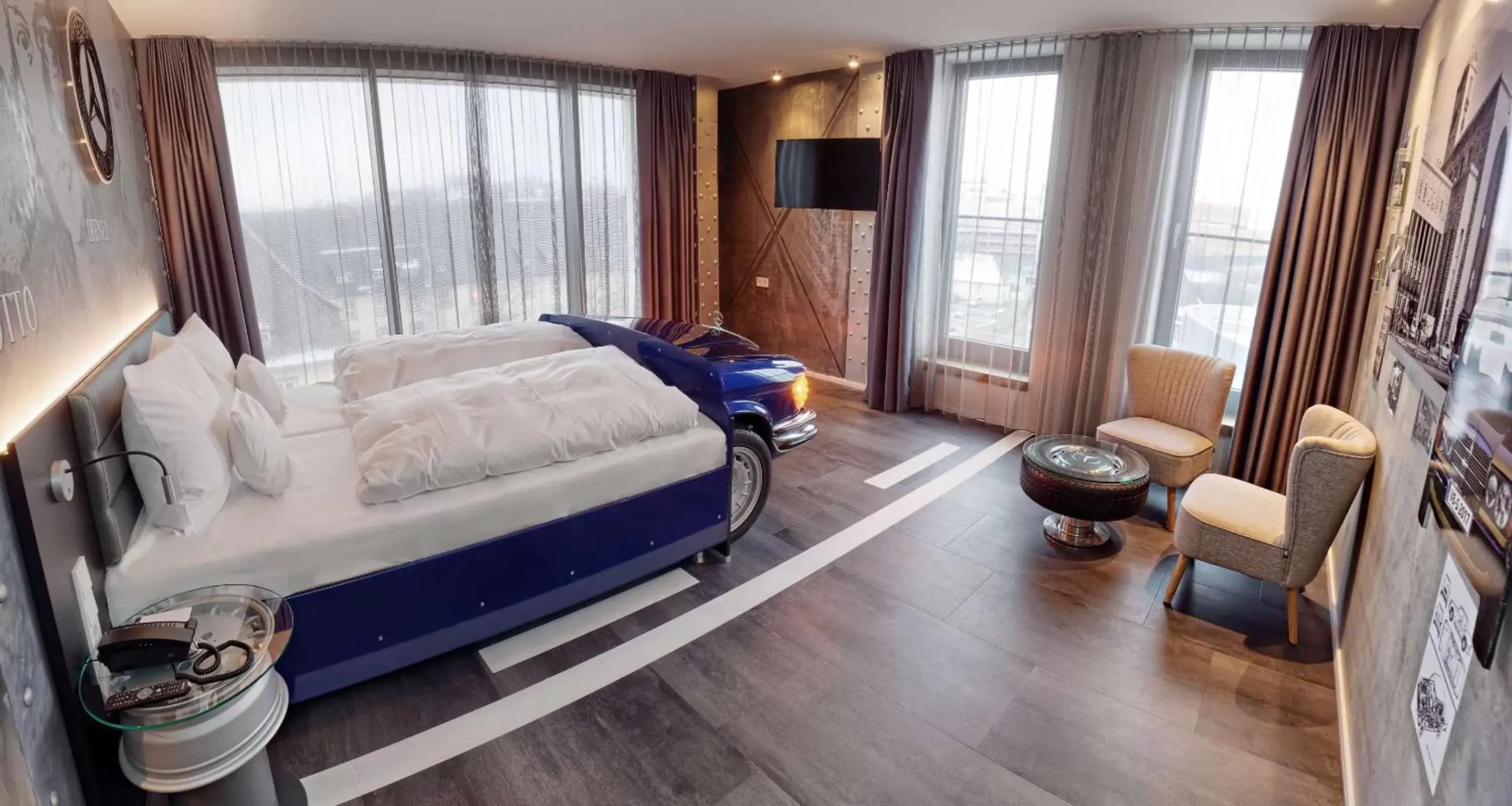 Bedroom, Seating Area in V8 HOTEL Motorworld Region Stuttgart