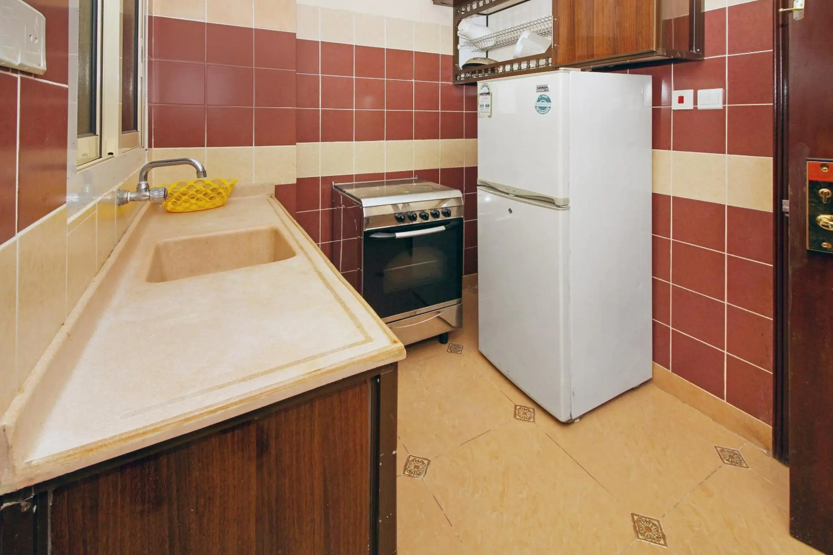 Bedroom, Kitchen/Kitchenette in OYO 589 Lavina House