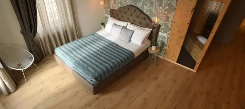 Bed in Lainez Rooms & Suites