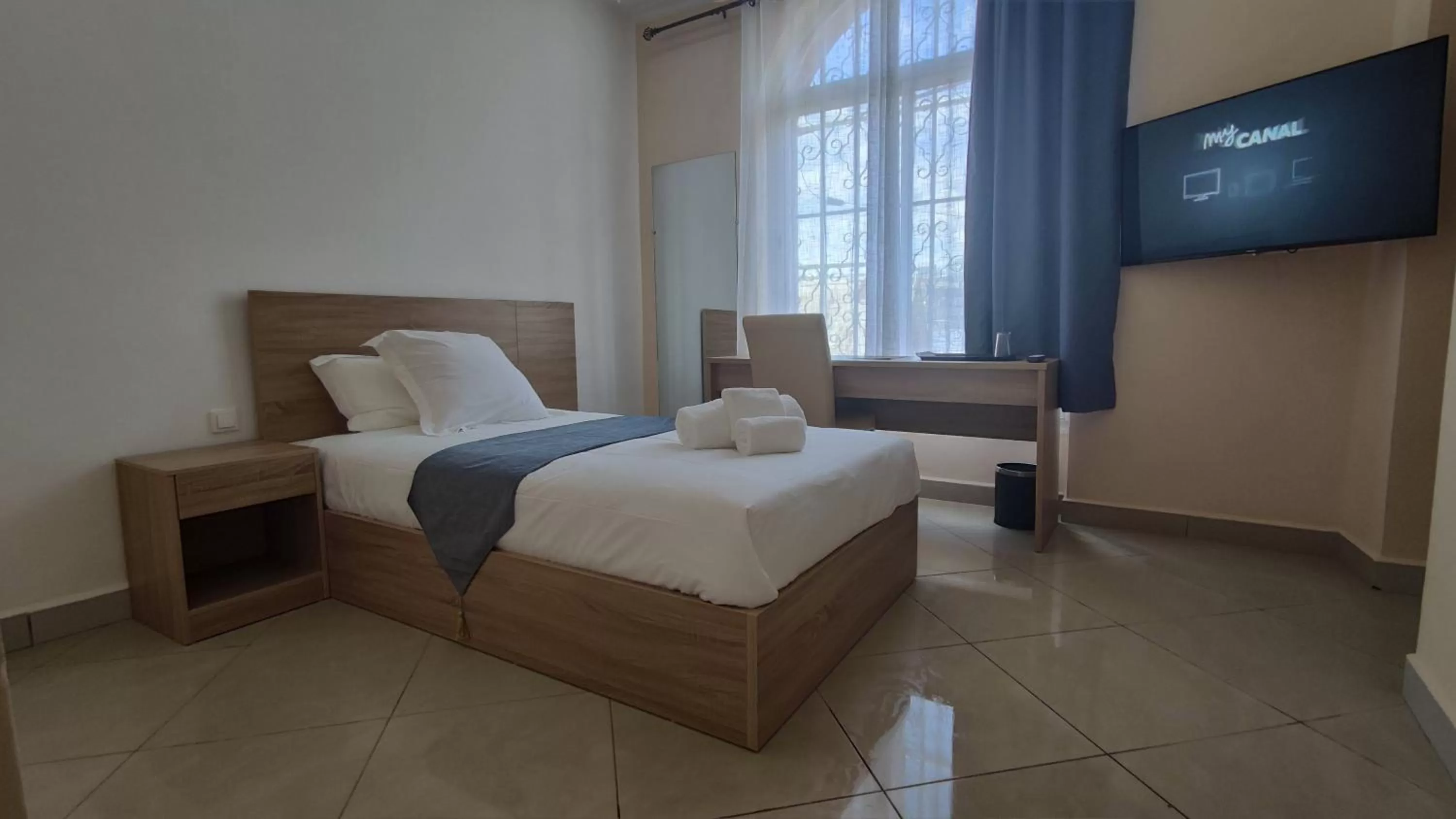 Bed in Downtown Hotel