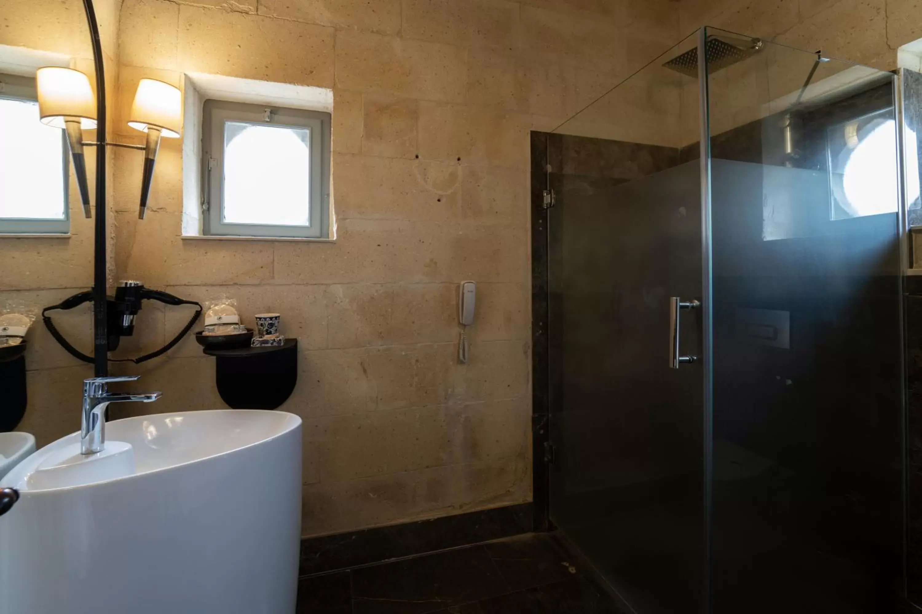 Bathroom in Artemis Cave Suites & Spa- Adults Only