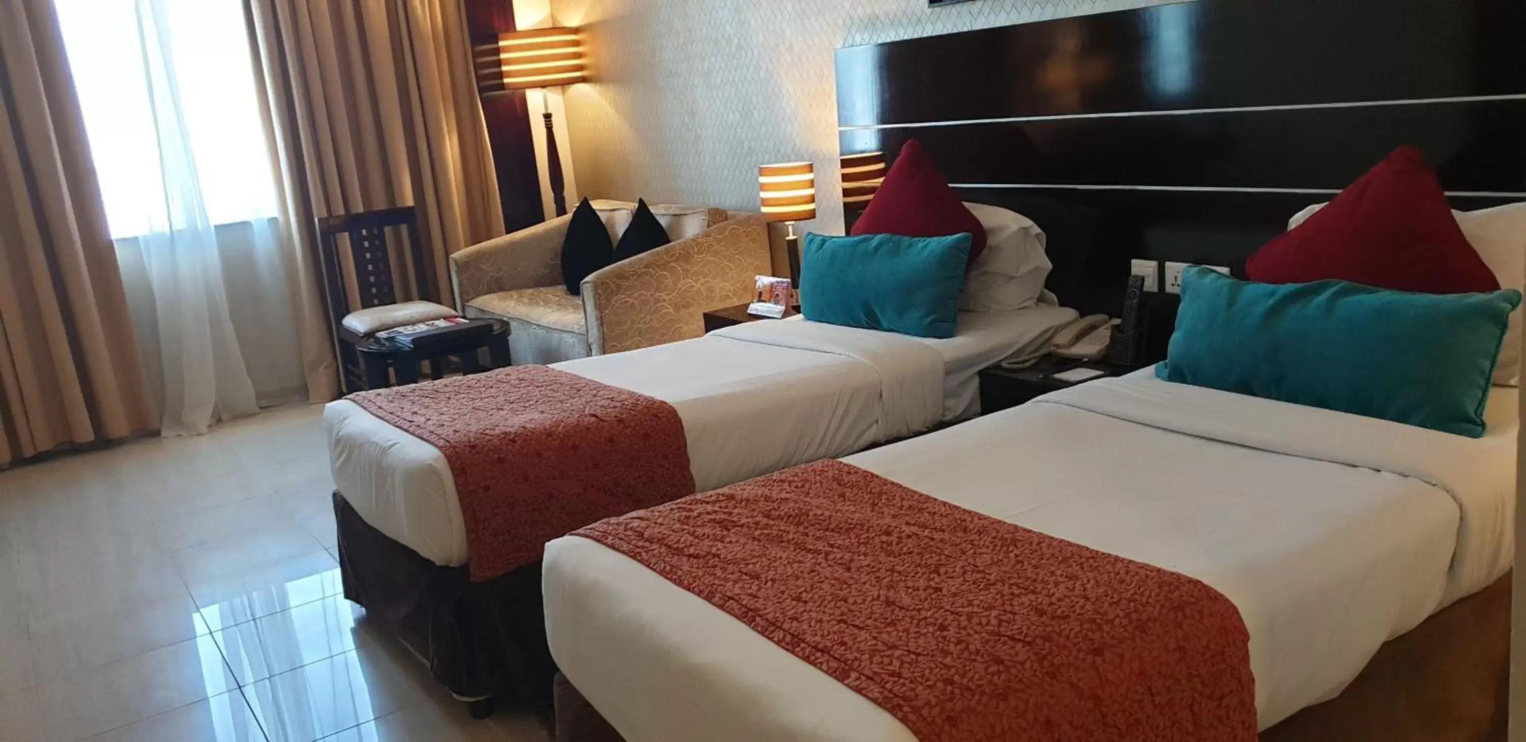 Bed in Landmark Riqqa Hotel