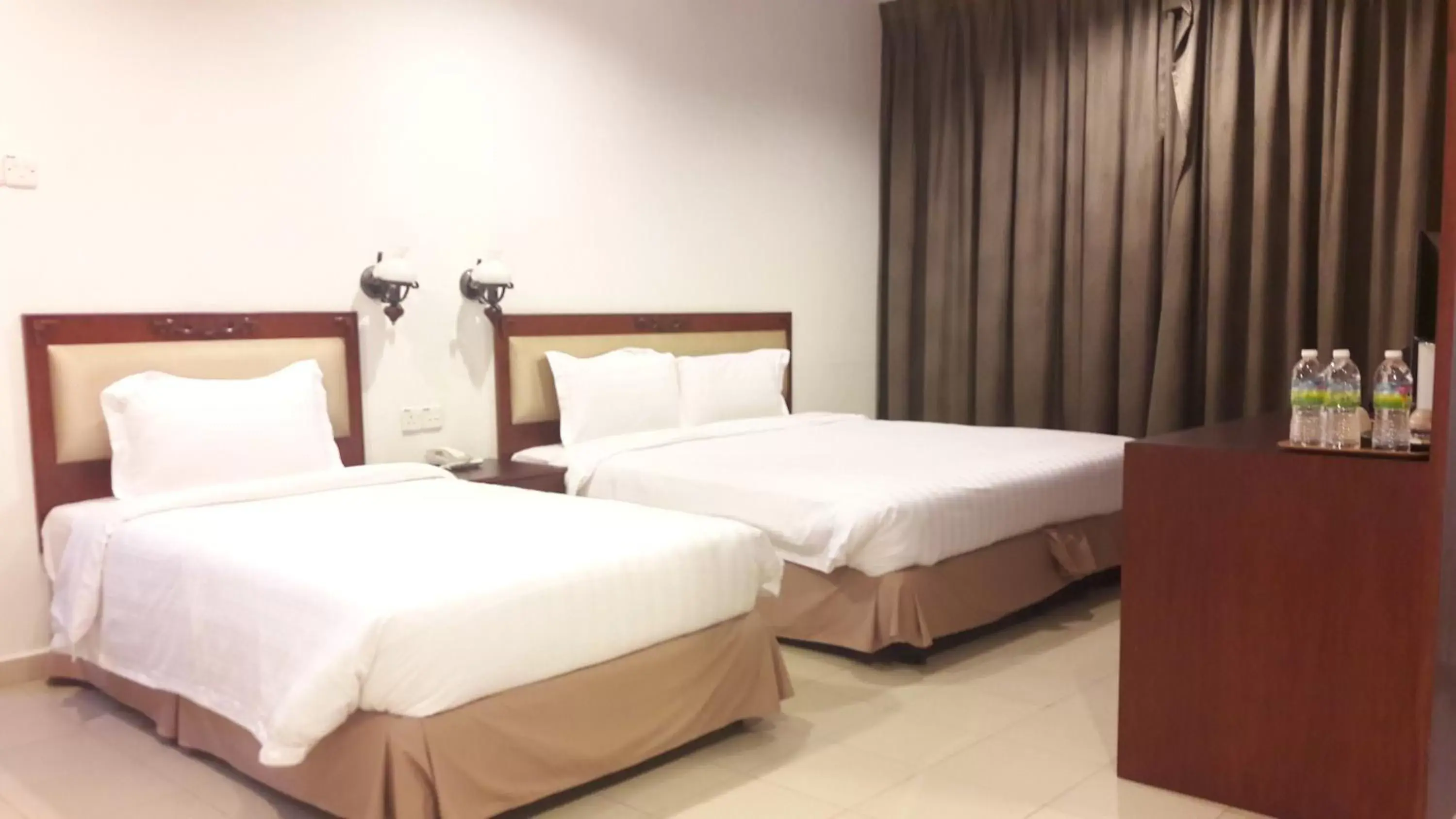 Bed in Cheng Ho Hotel