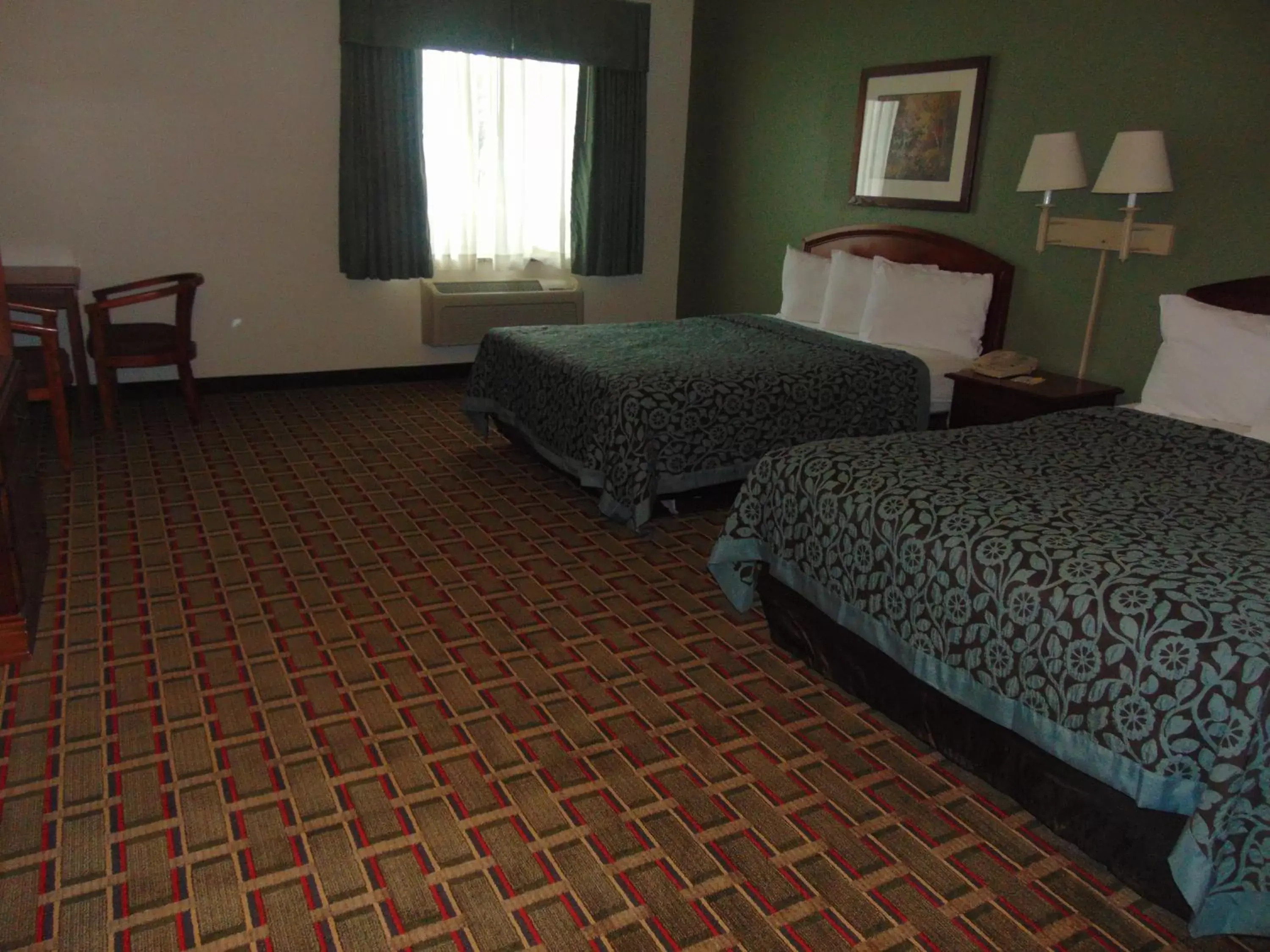 Seating area, Bed in Days Inn by Wyndham Pentwater