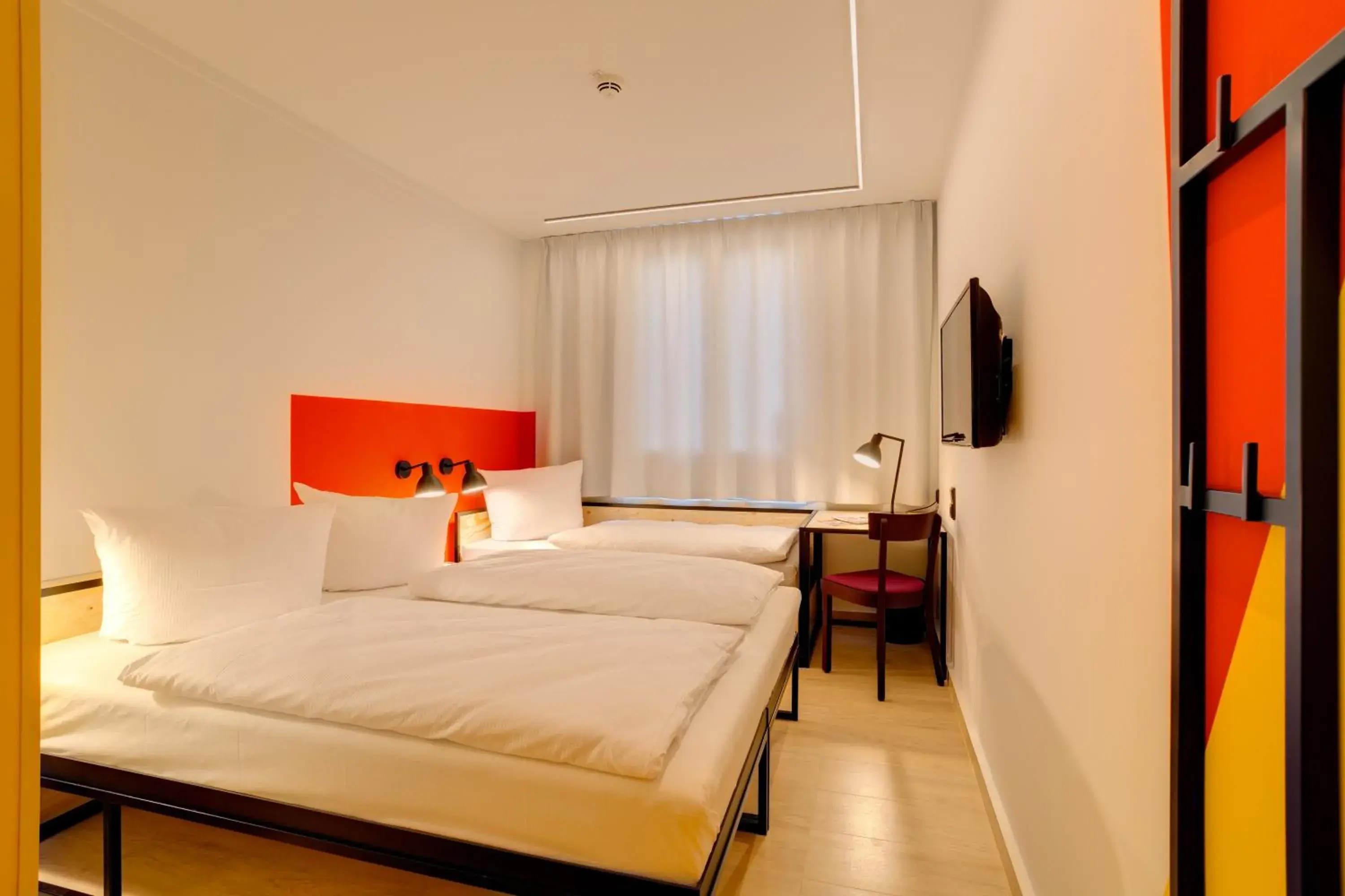 Photo of the whole room, Bed in MEININGER Hotel Leipzig Hauptbahnhof