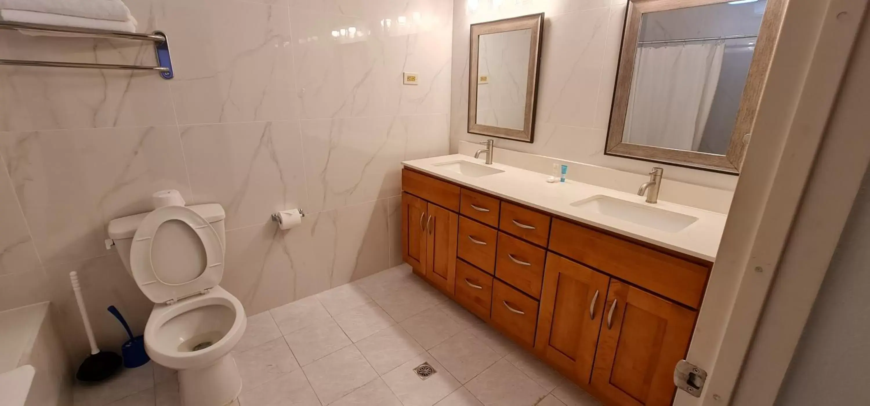 Bathroom in SureStay Hotel by Best Western Guam Palmridge