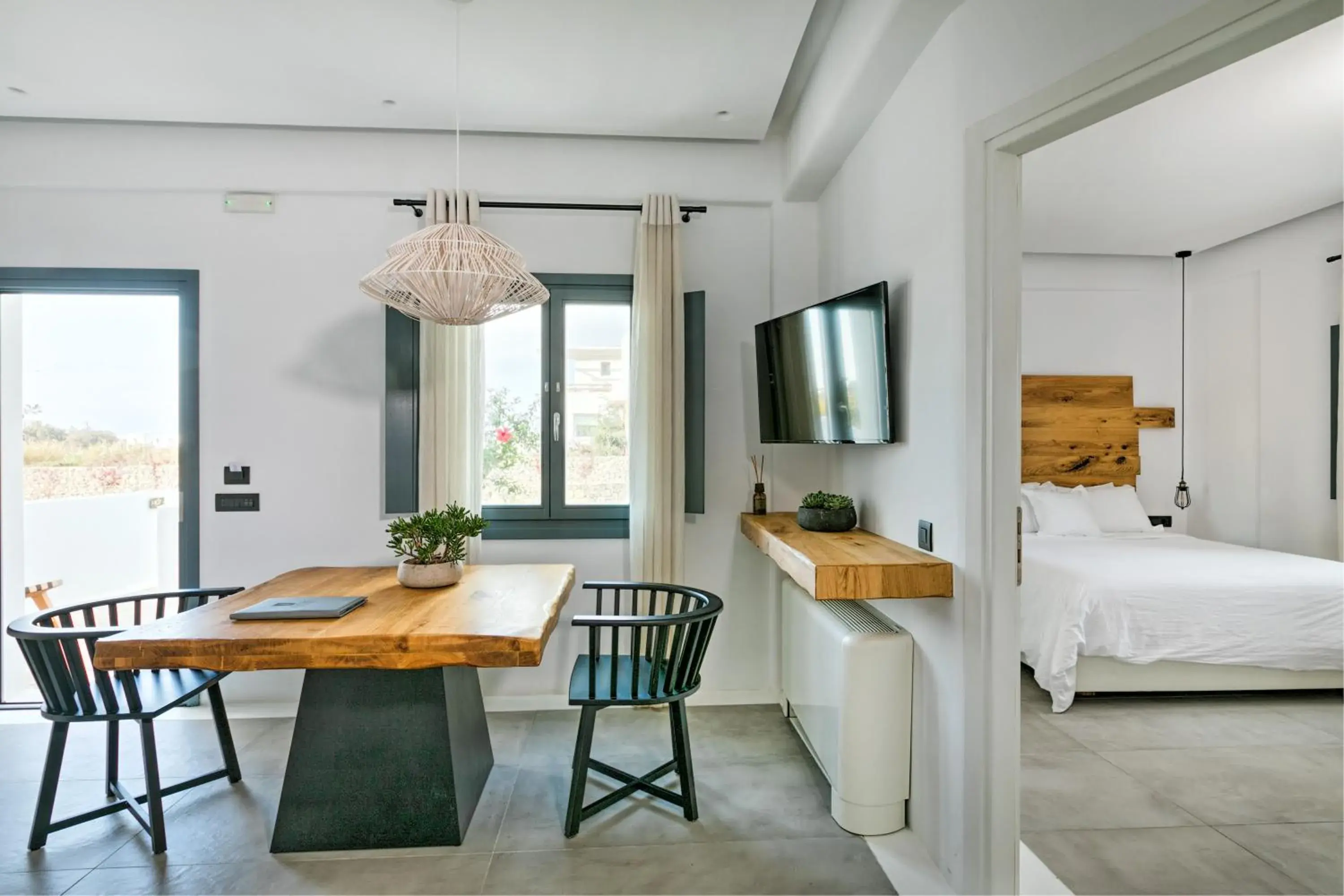 Bed, Dining Area in Portes Suites & Villas Mykonos