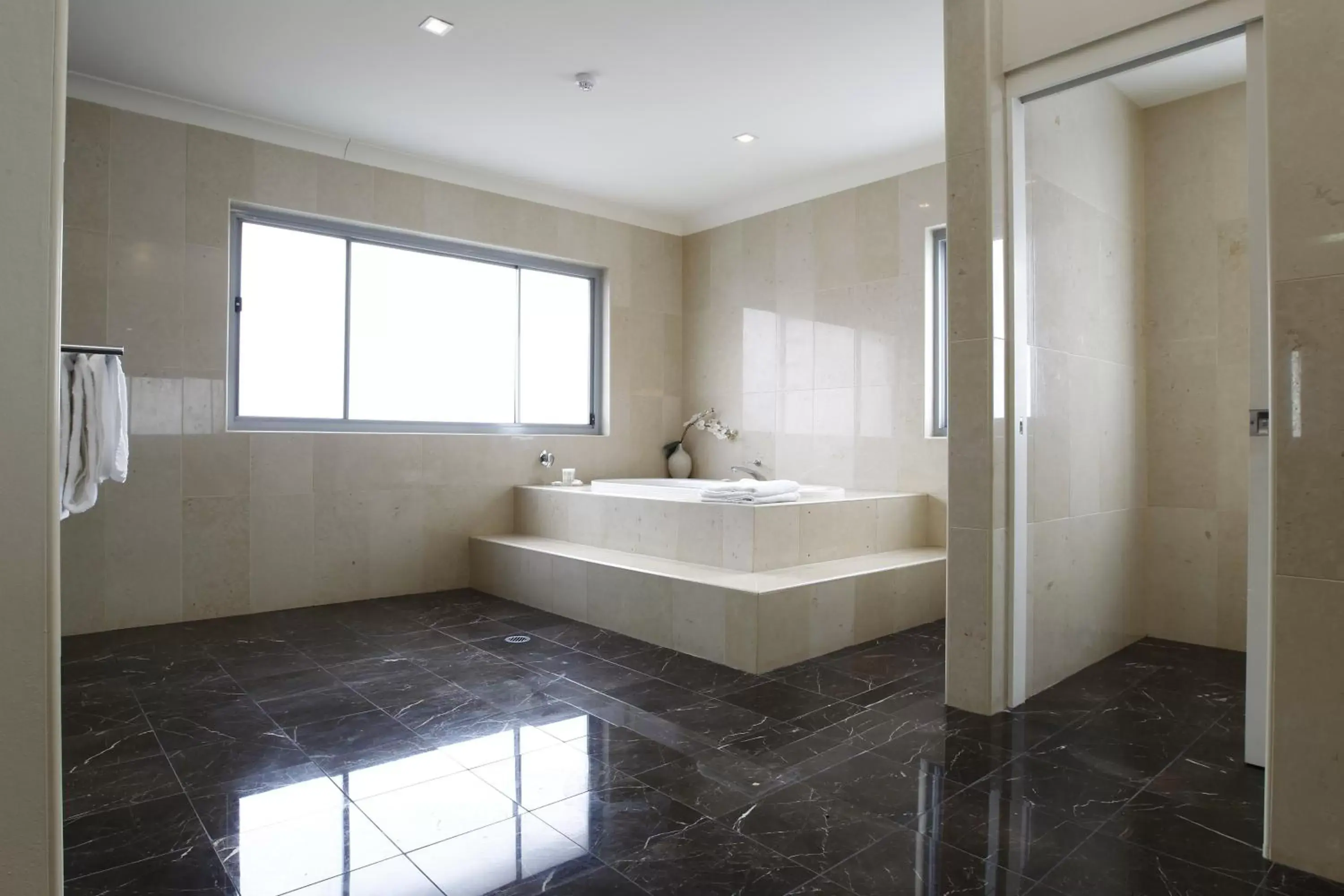 Bathroom in Ramada Hotel & Suites by Wyndham Cabramatta