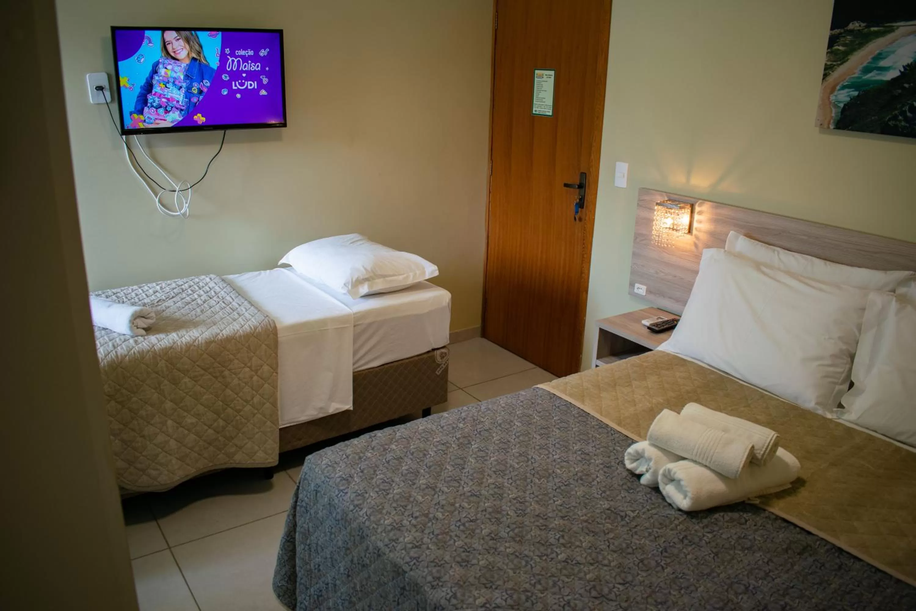 Bed in Pousada Tissiano