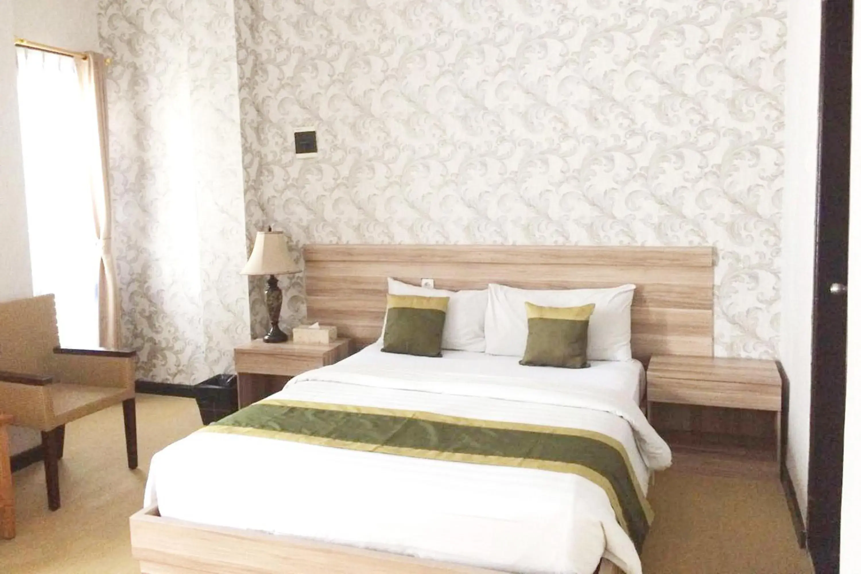 Bed in Puri Saron Denpasar Hotel
