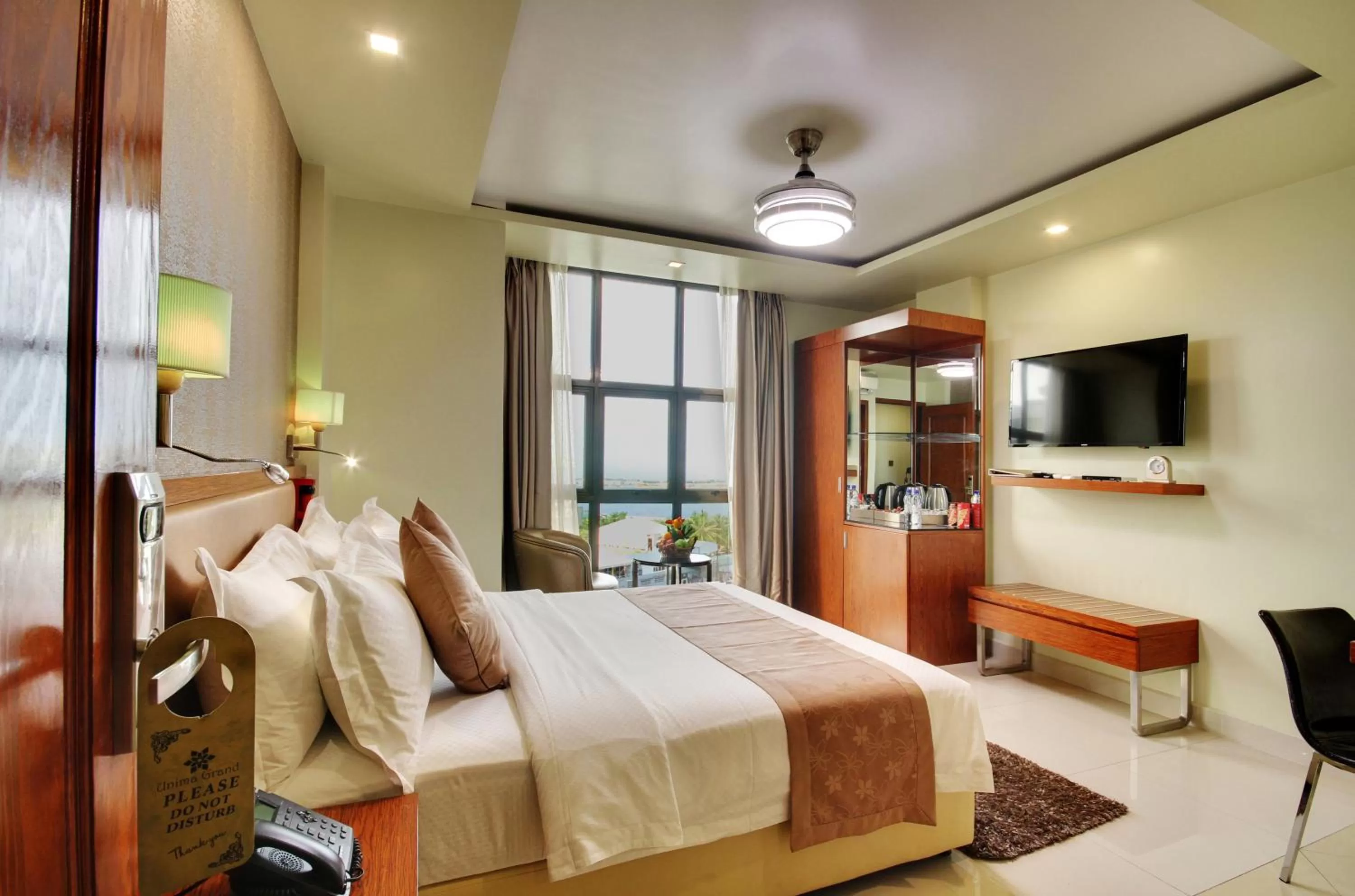 Photo of the whole room, Bed in Unima Grand