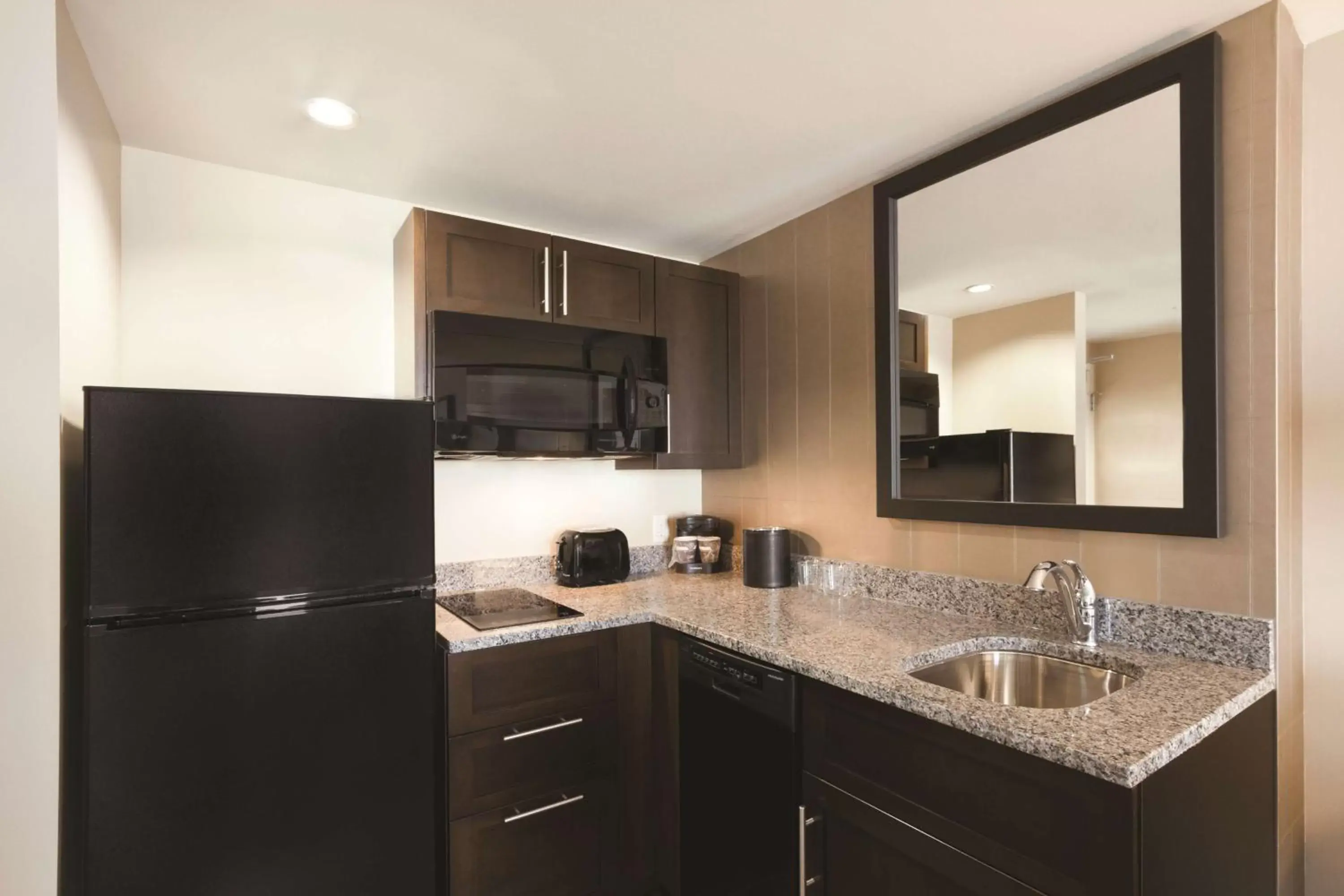 Bedroom, Kitchen/Kitchenette in Embassy Suites Springfield