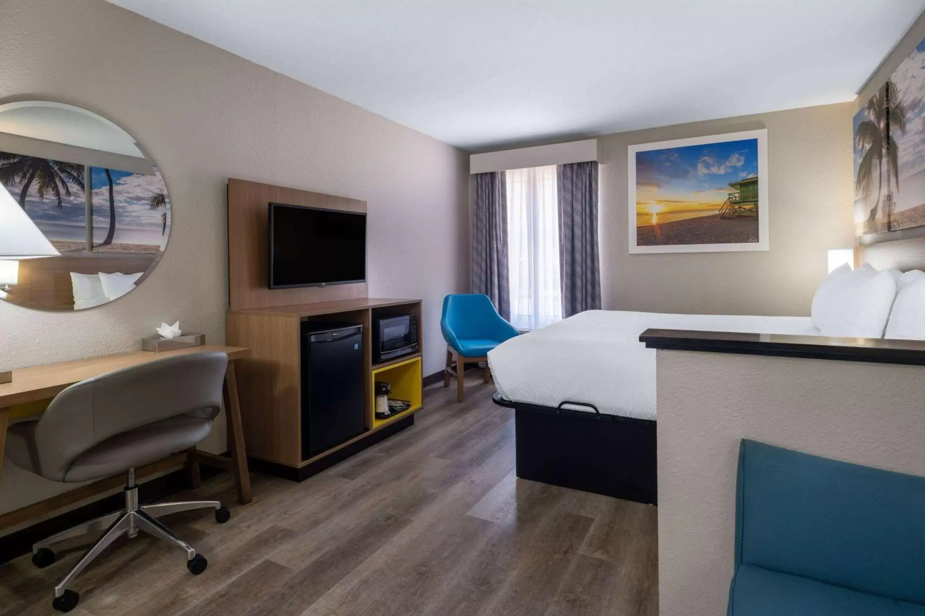 Photo of the whole room, TV/Entertainment Center in Days Inn & Suites by Wyndham Commerce