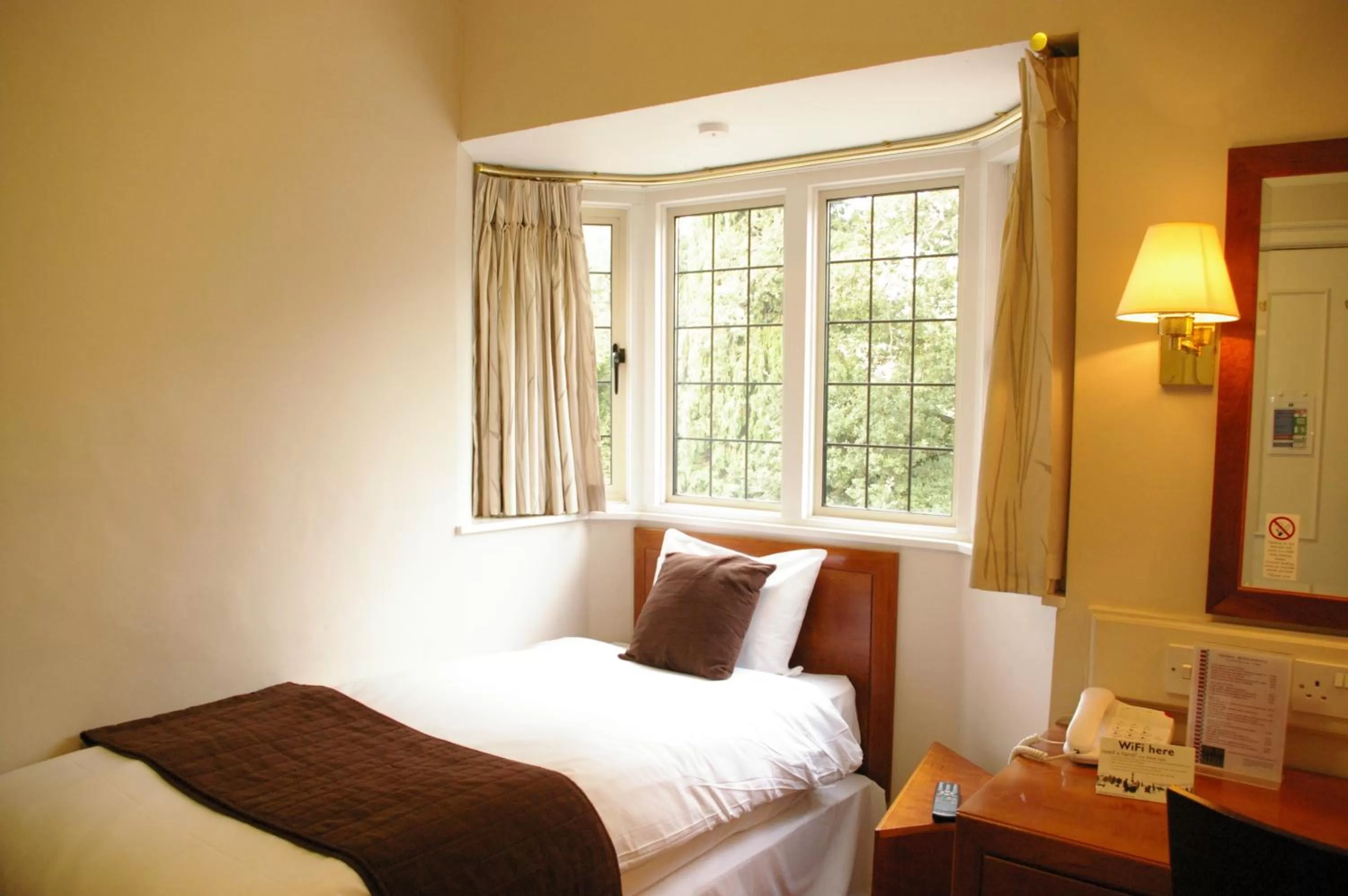 Bed in Farnham House Hotel