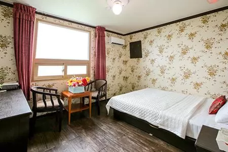 Bed in Saipan Motel with Sea View