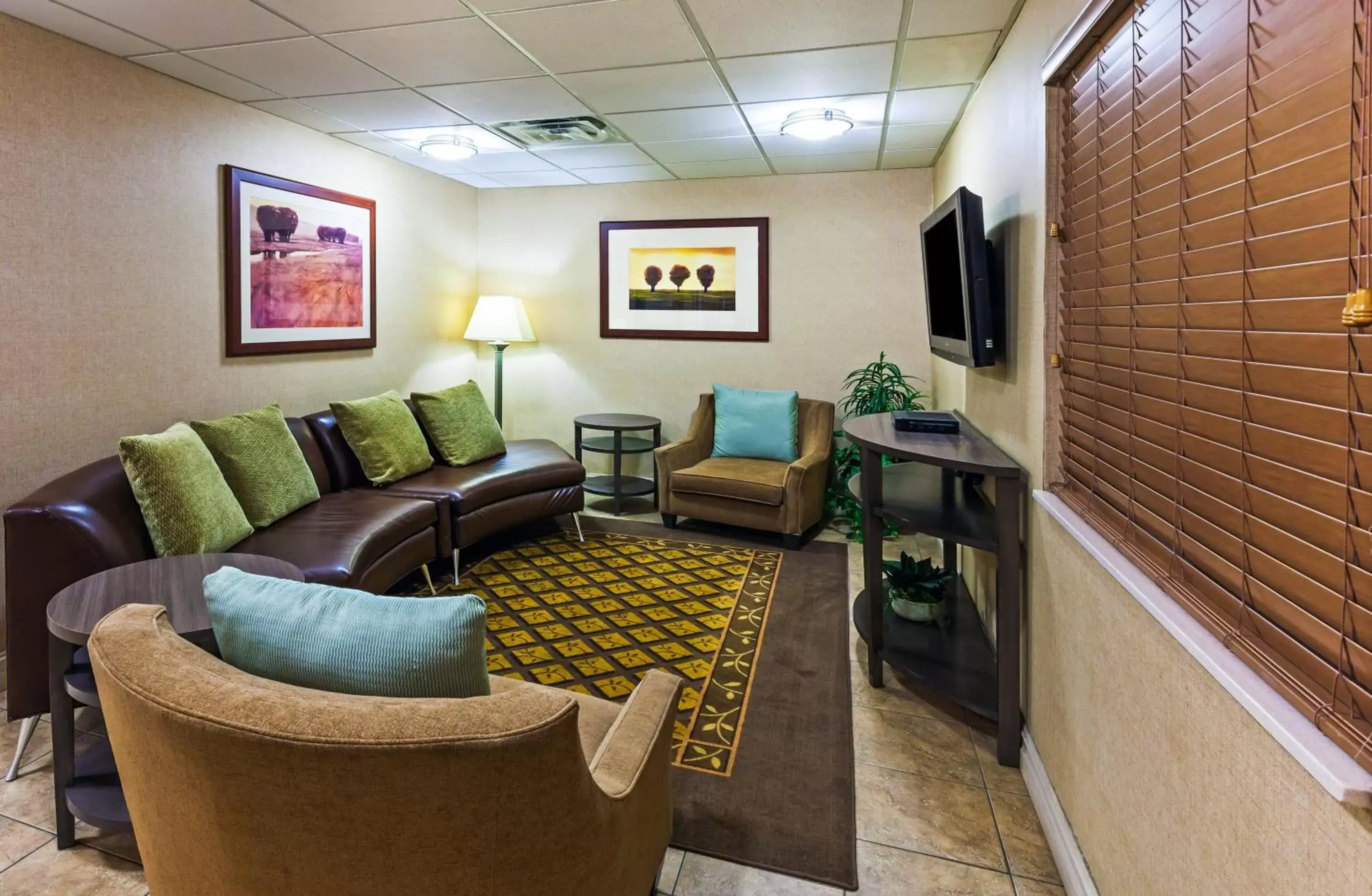 Property building, Seating Area in Candlewood Suites Owasso, an IHG Hotel