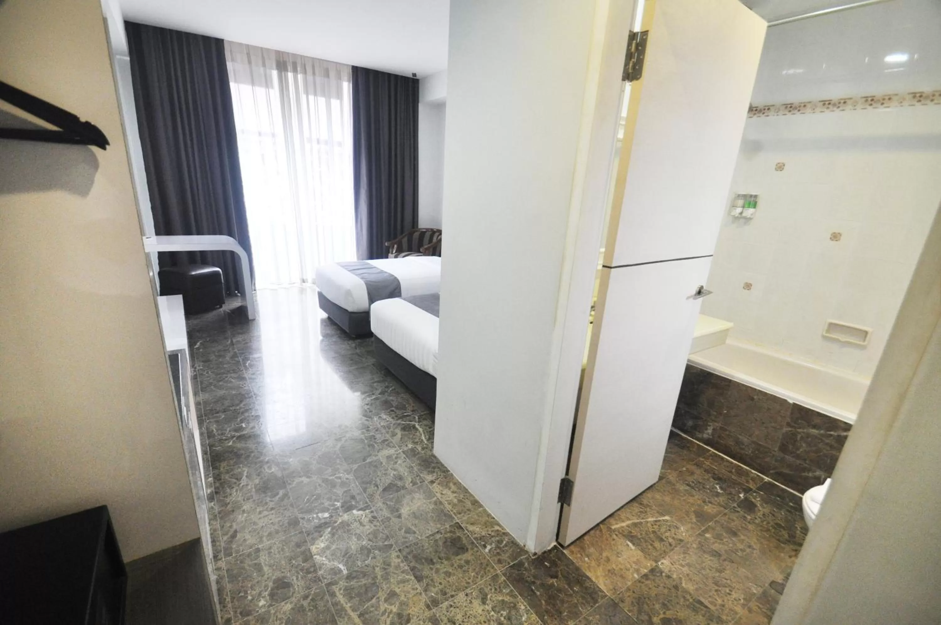 Bathroom, Bed in Dreamtel Jakarta