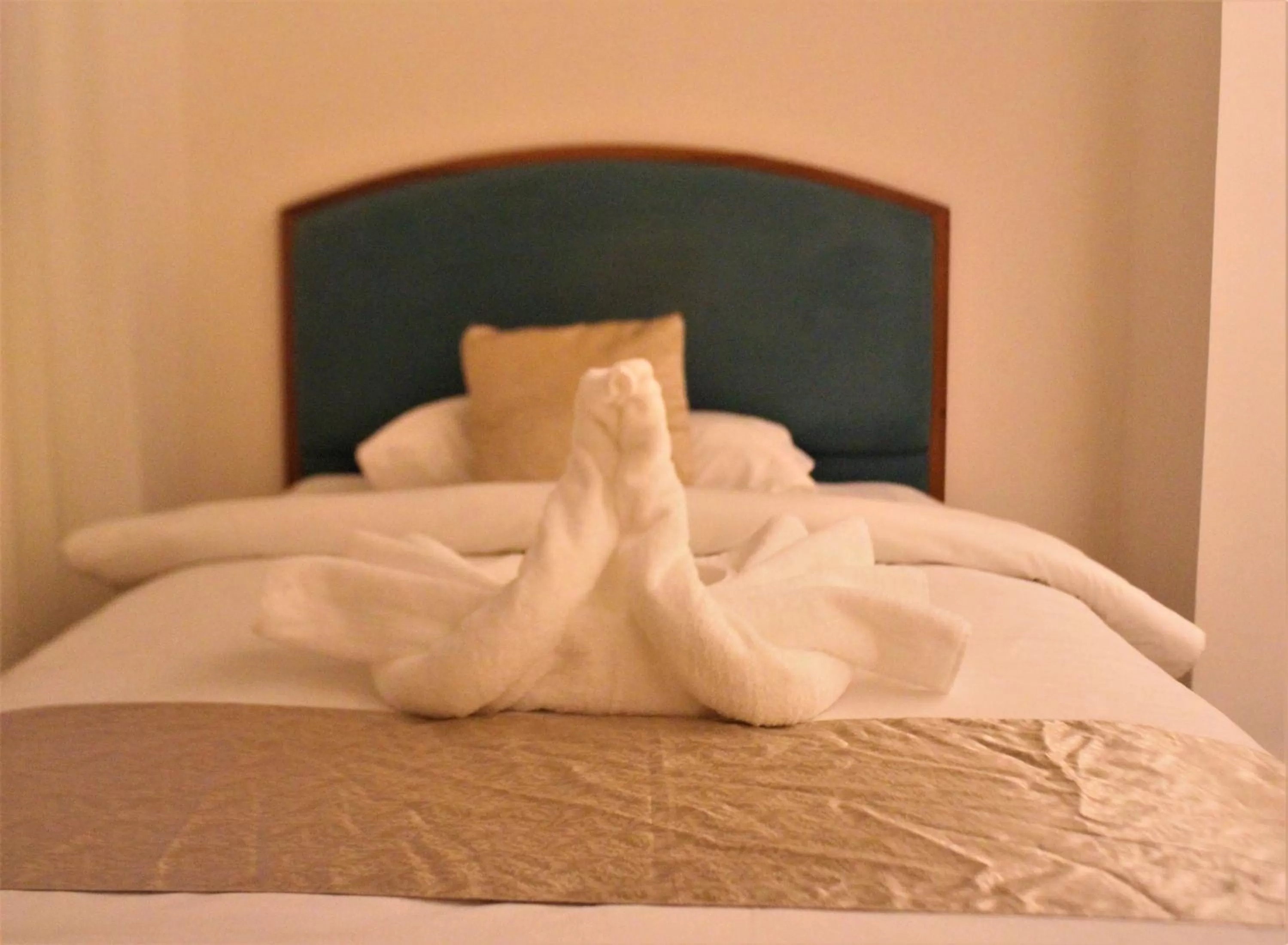 Bed in New MerryLand Hotel