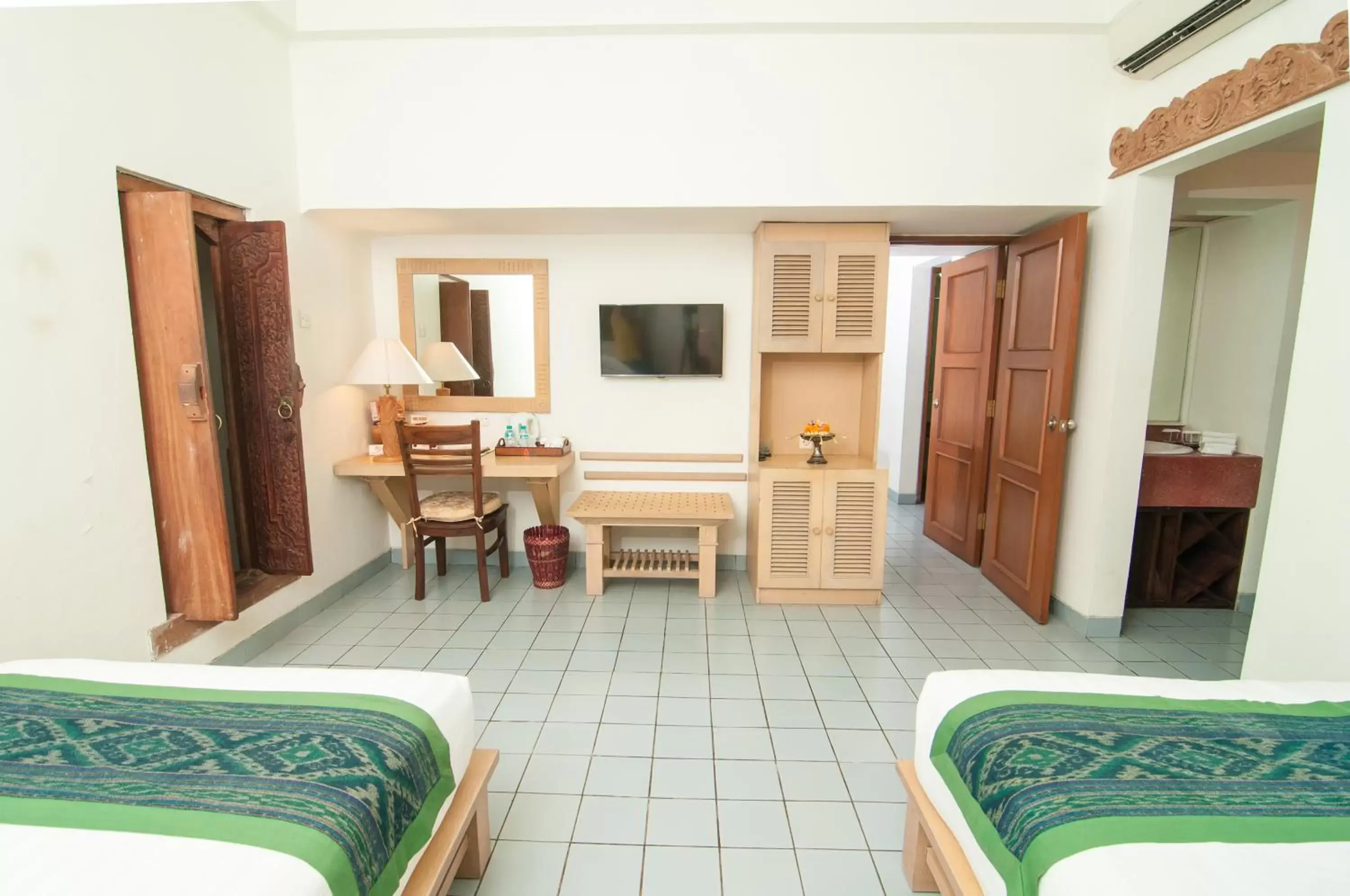 Bedroom, TV/Entertainment Center in Sativa Sanur Cottages