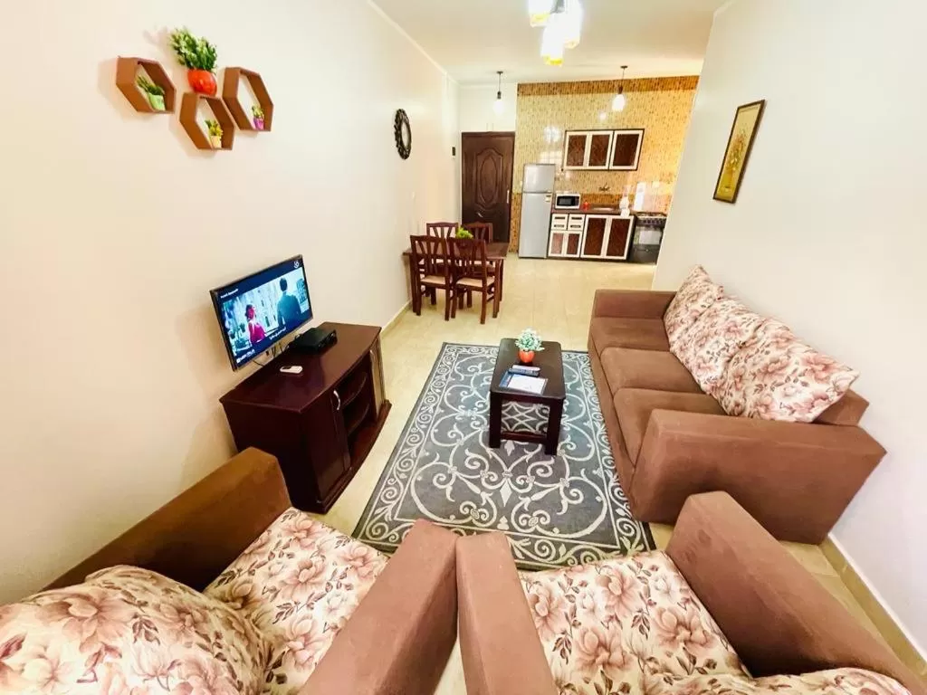 Communal lounge/ TV room, Seating Area in Charbel apartments