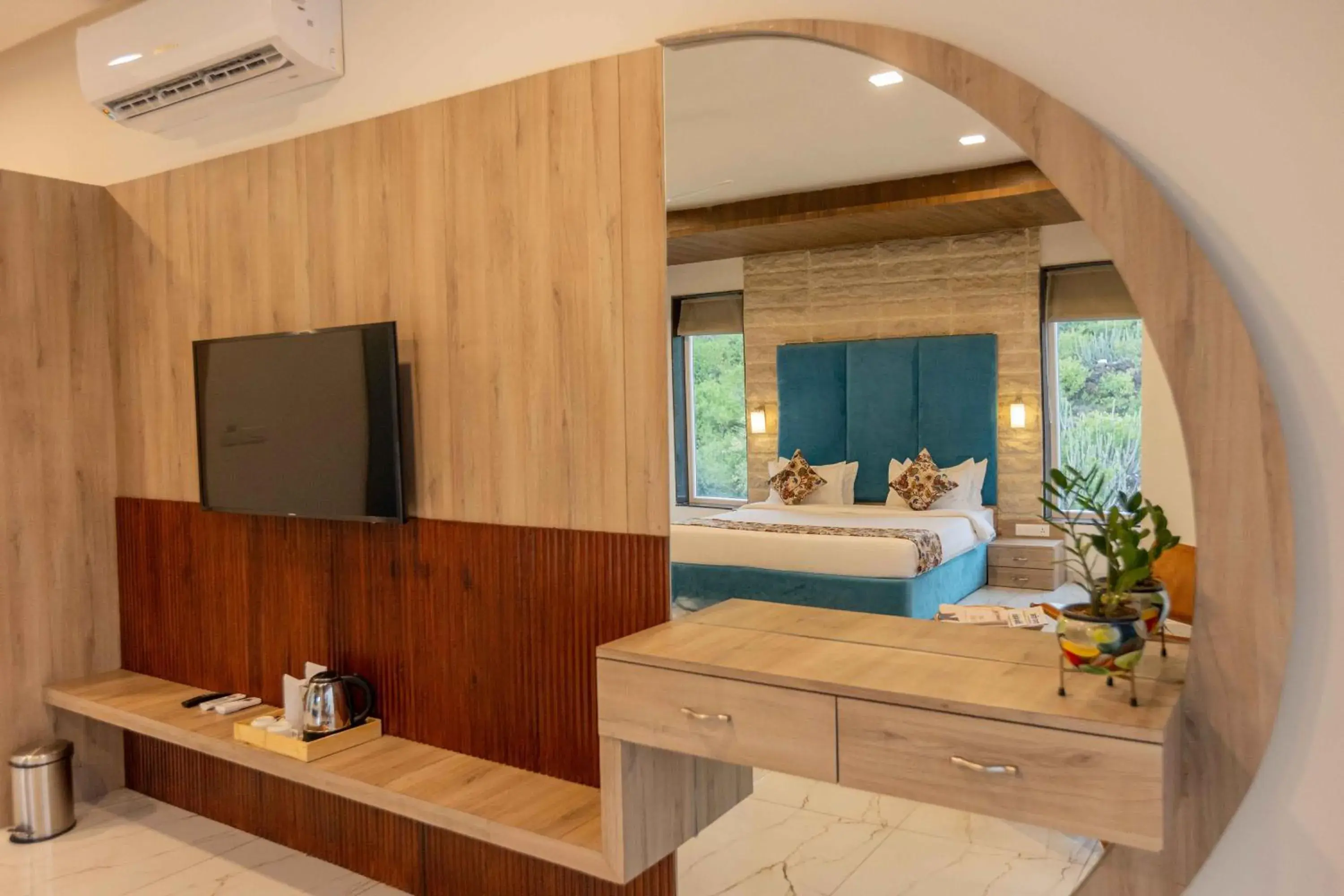 Bed, TV/Entertainment Center in Suramya Villa