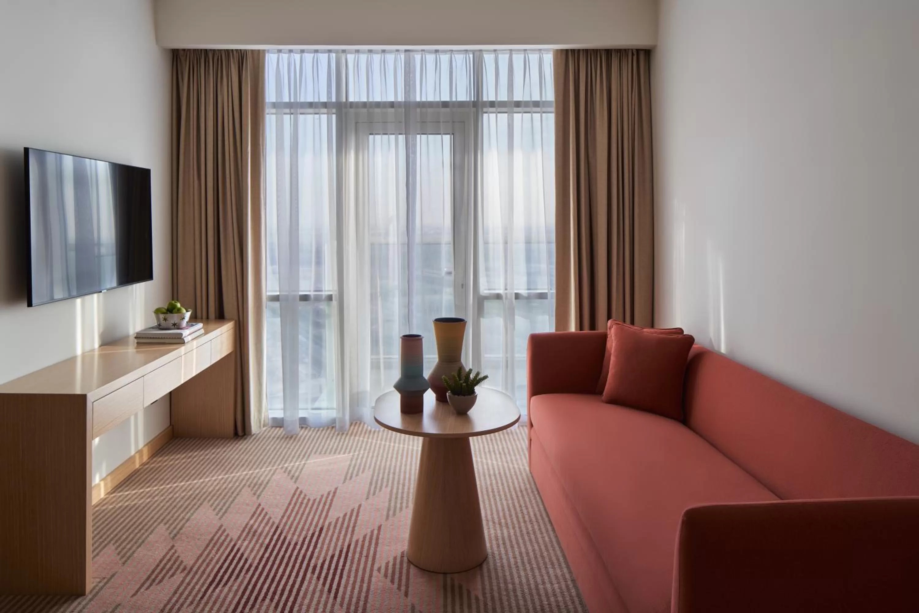 Communal lounge/ TV room in Novotel Jumeirah Village Triangle