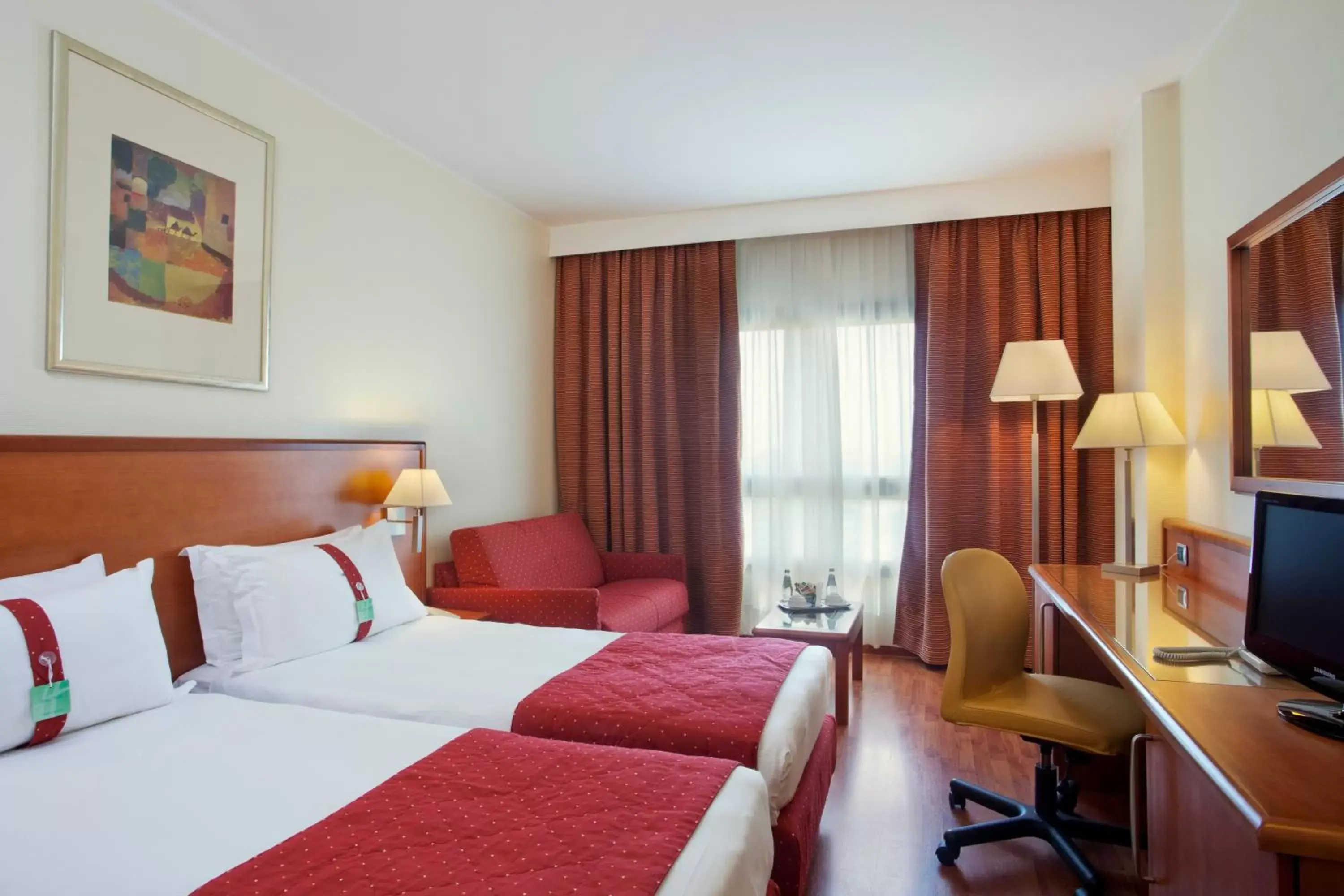 Bed in Holiday Inn Cagliari, an IHG Hotel