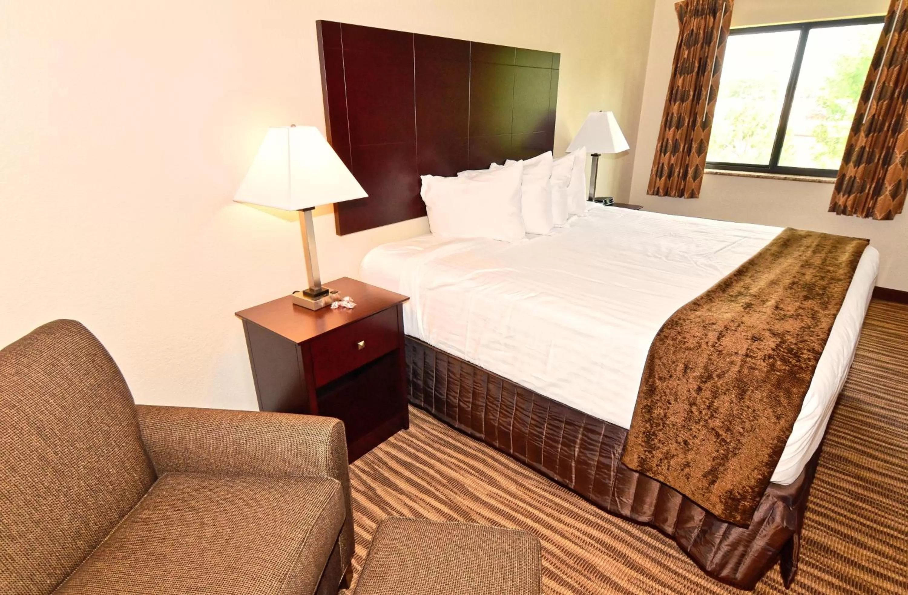 Bed in Cobblestone Inn & Suites - Clarion