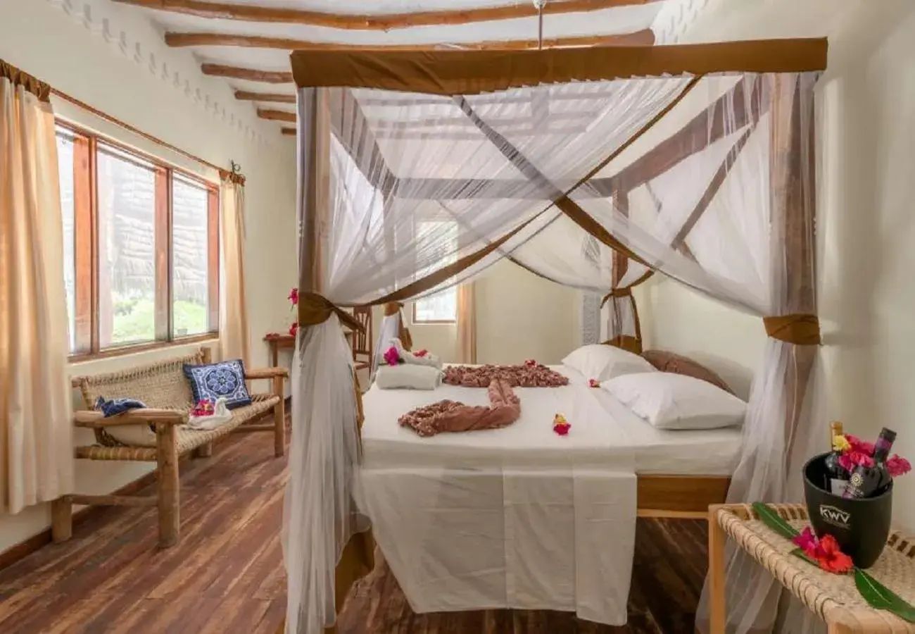 Bedroom, Bed in Hakuna Majiwe Beach Lodge Zanzibar