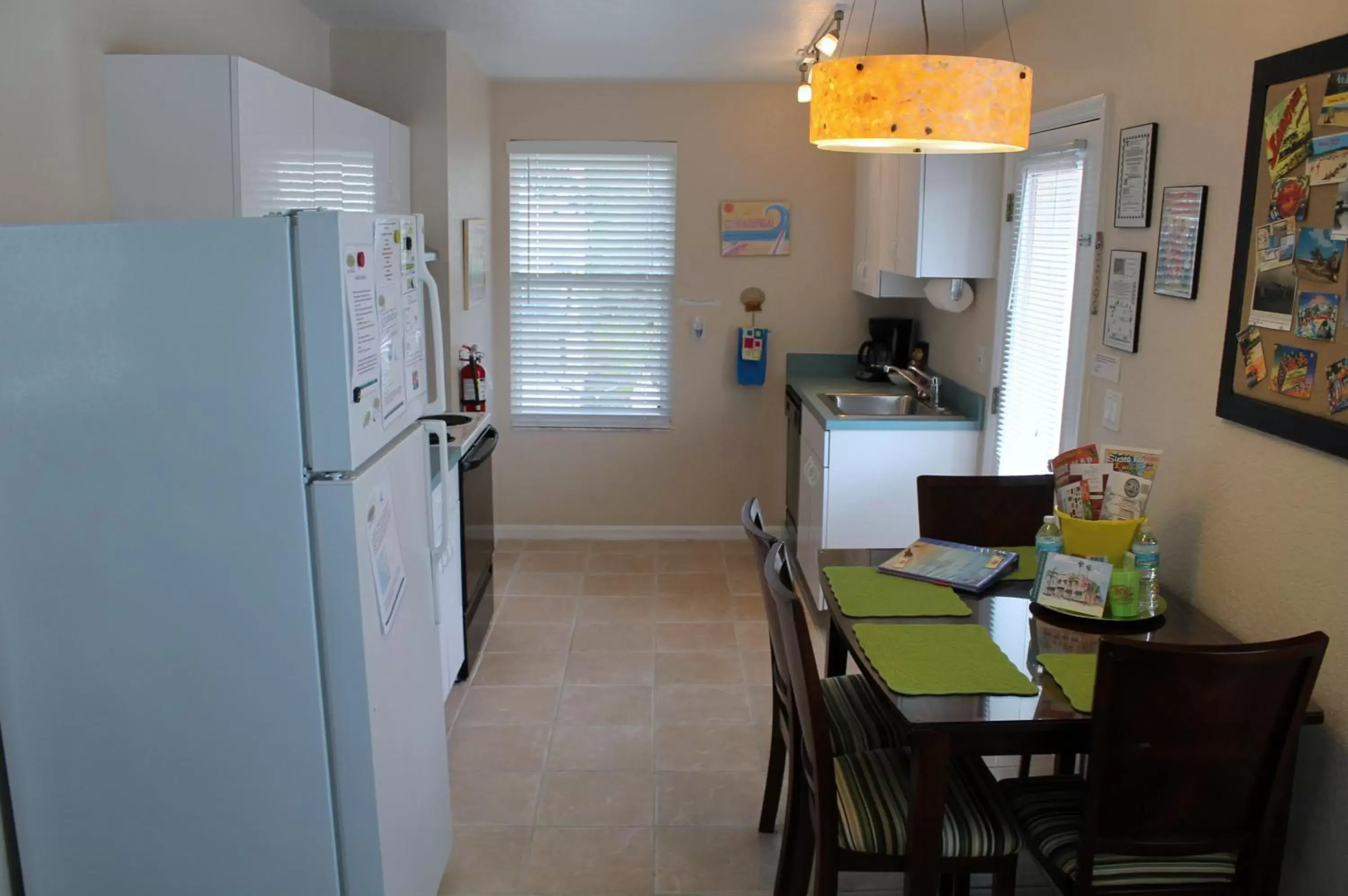 Kitchen or kitchenette, Dining Area in The Ringling Beach House