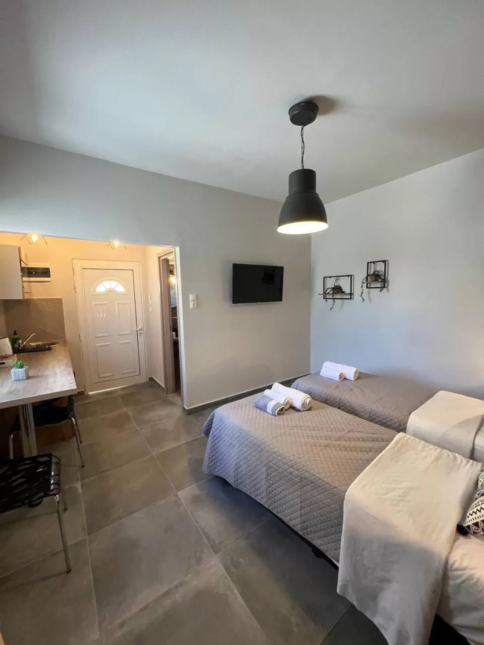 Bed in Elefsinian Mysteries Apartments