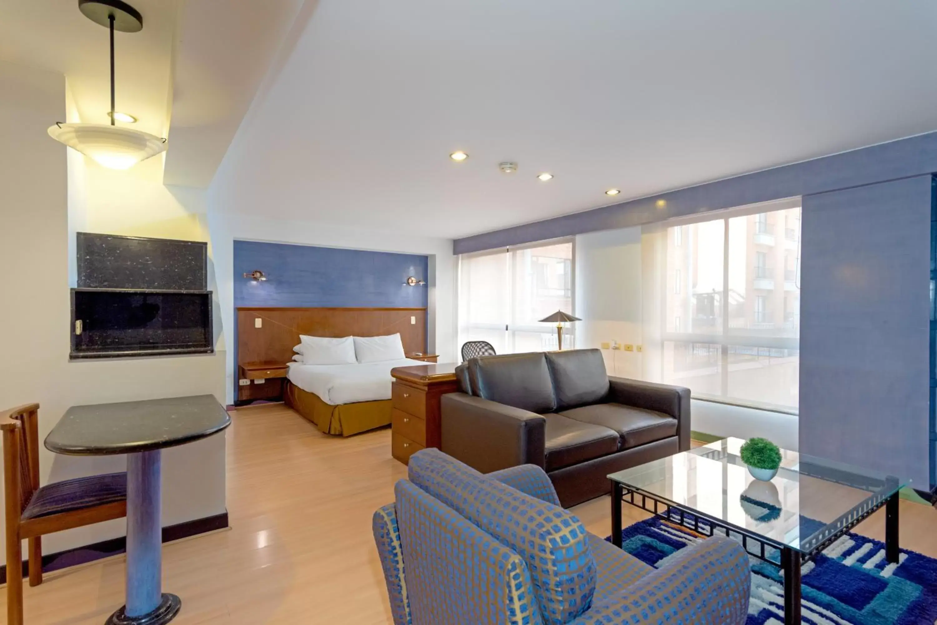 Bedroom, Seating Area in GIO Suites Parque 93 Bogotá