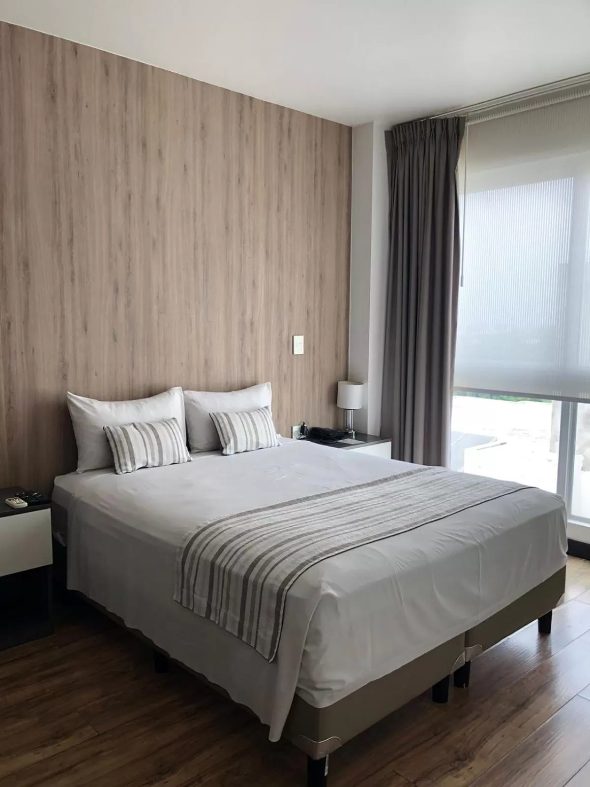 Bed in Urban Suites Apart Hotel