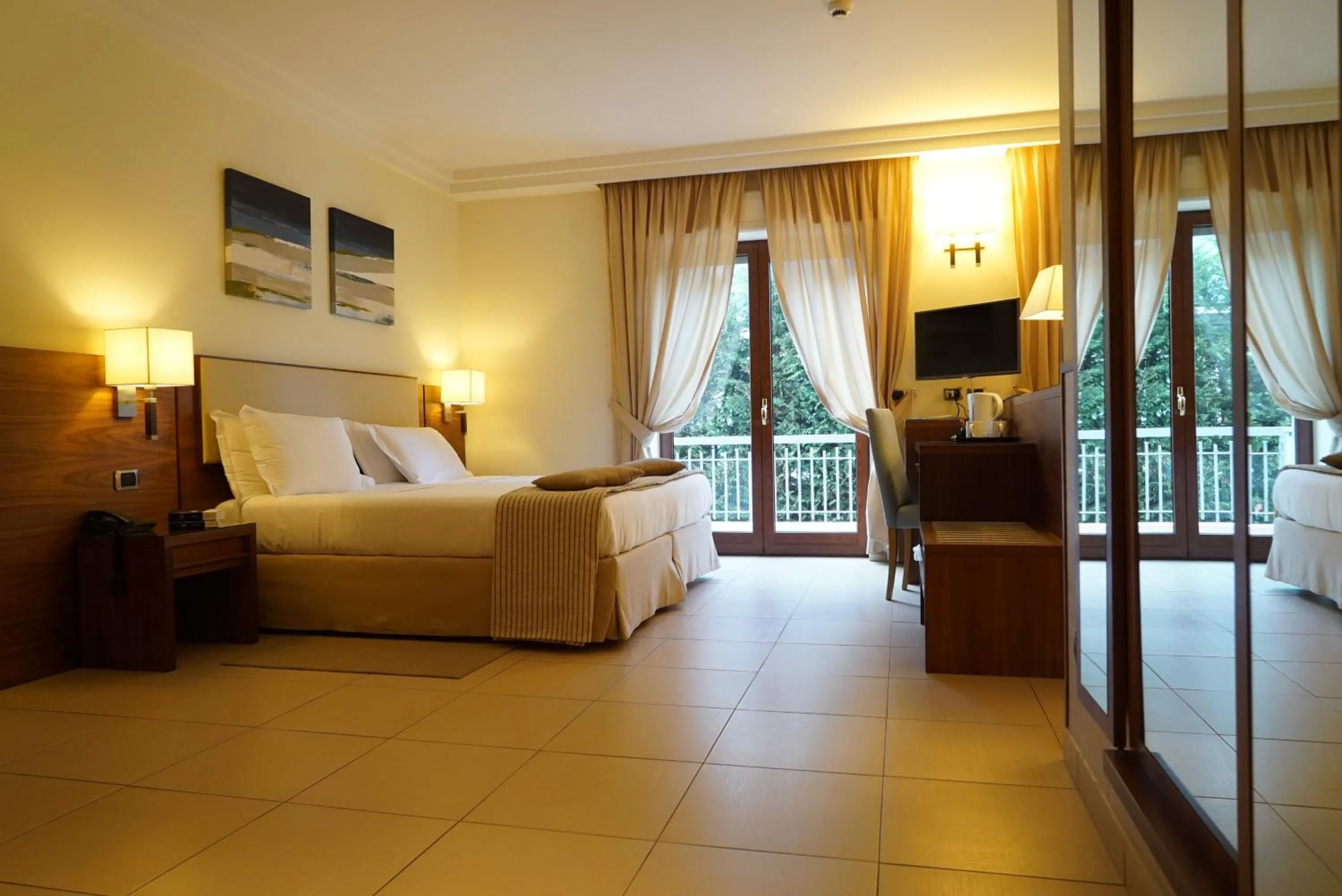 Bed in Suites & Residence Hotel