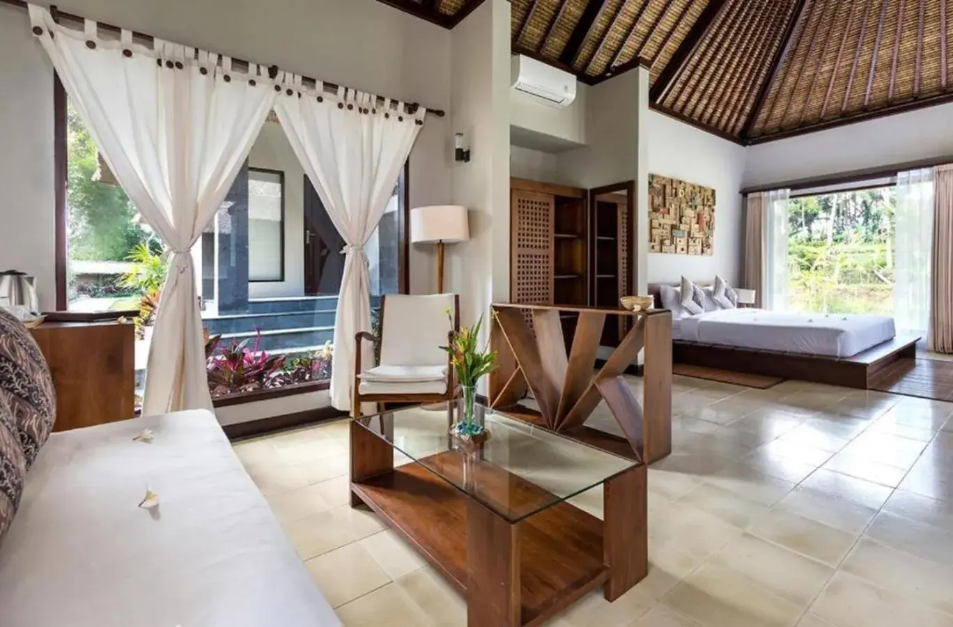 Bed, Seating Area in Suara Air Luxury Villa Ubud
