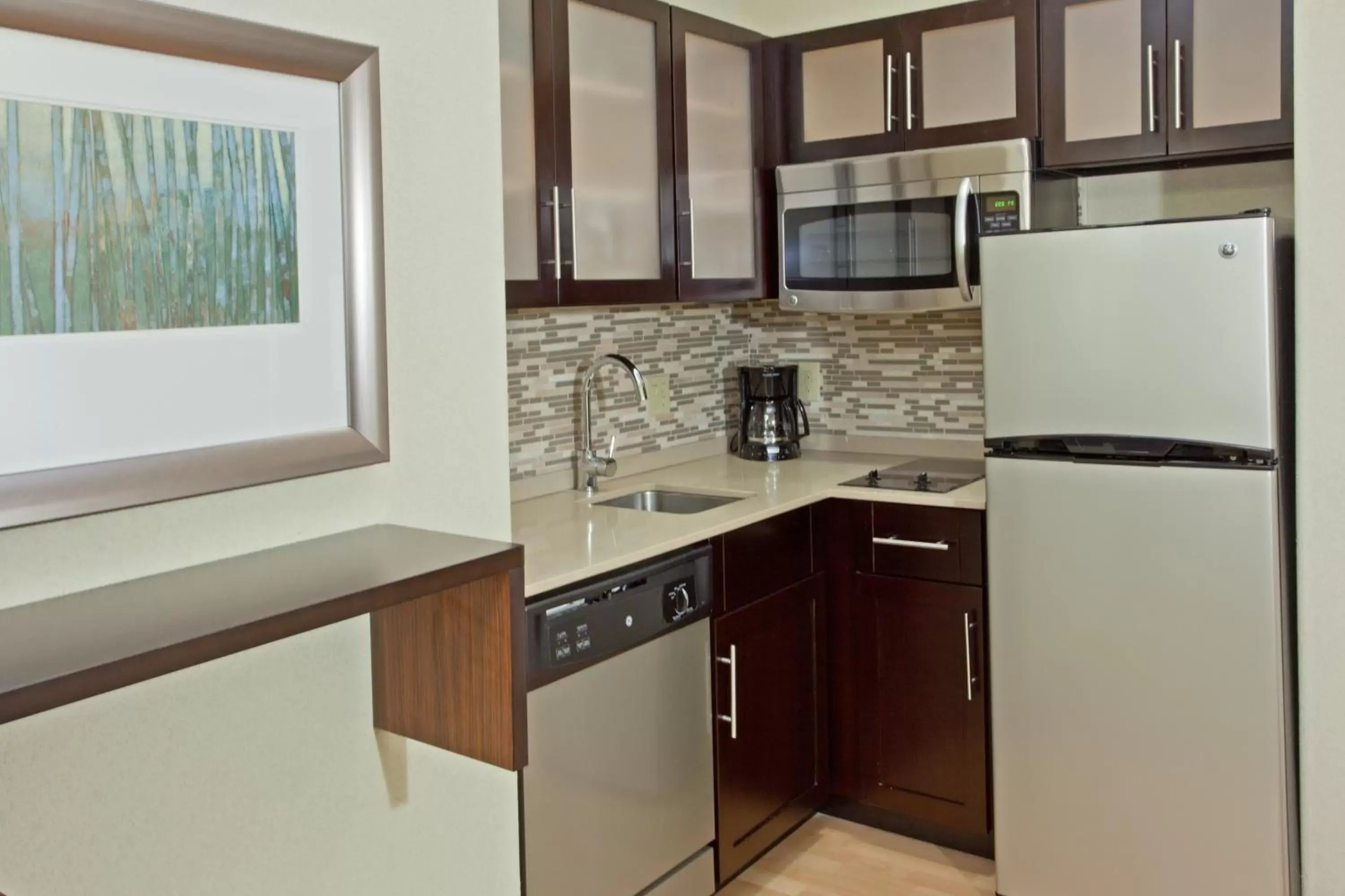 Photo of the whole room, Kitchen/Kitchenette in Staybridge Suites Houston Stafford - Sugar Land, an IHG Hotel