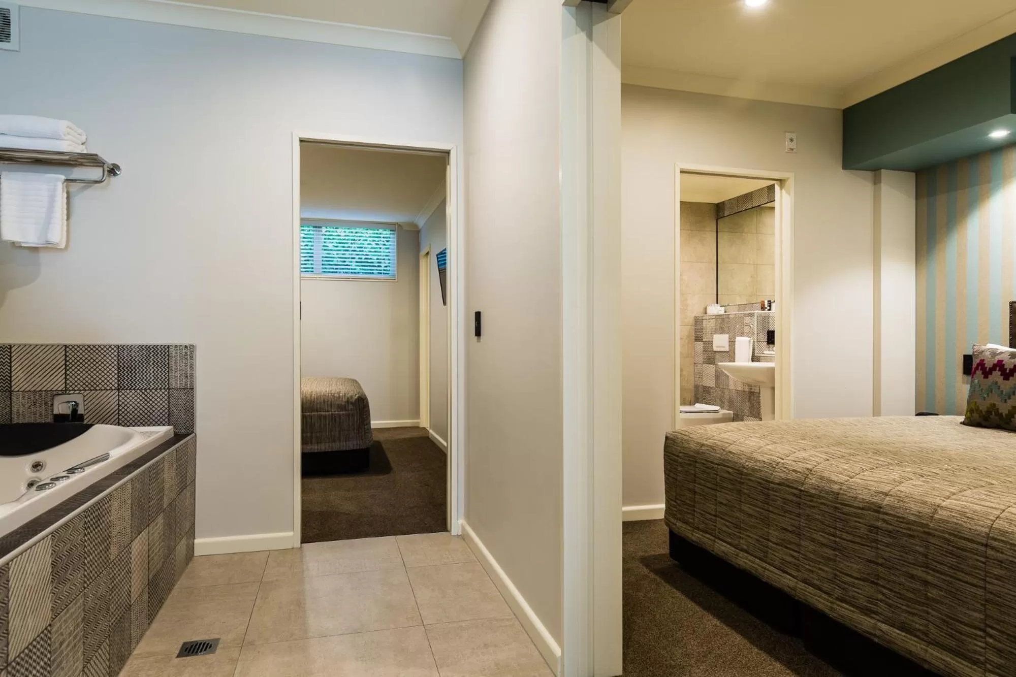 Bed in Pebble Beach Motor Inn