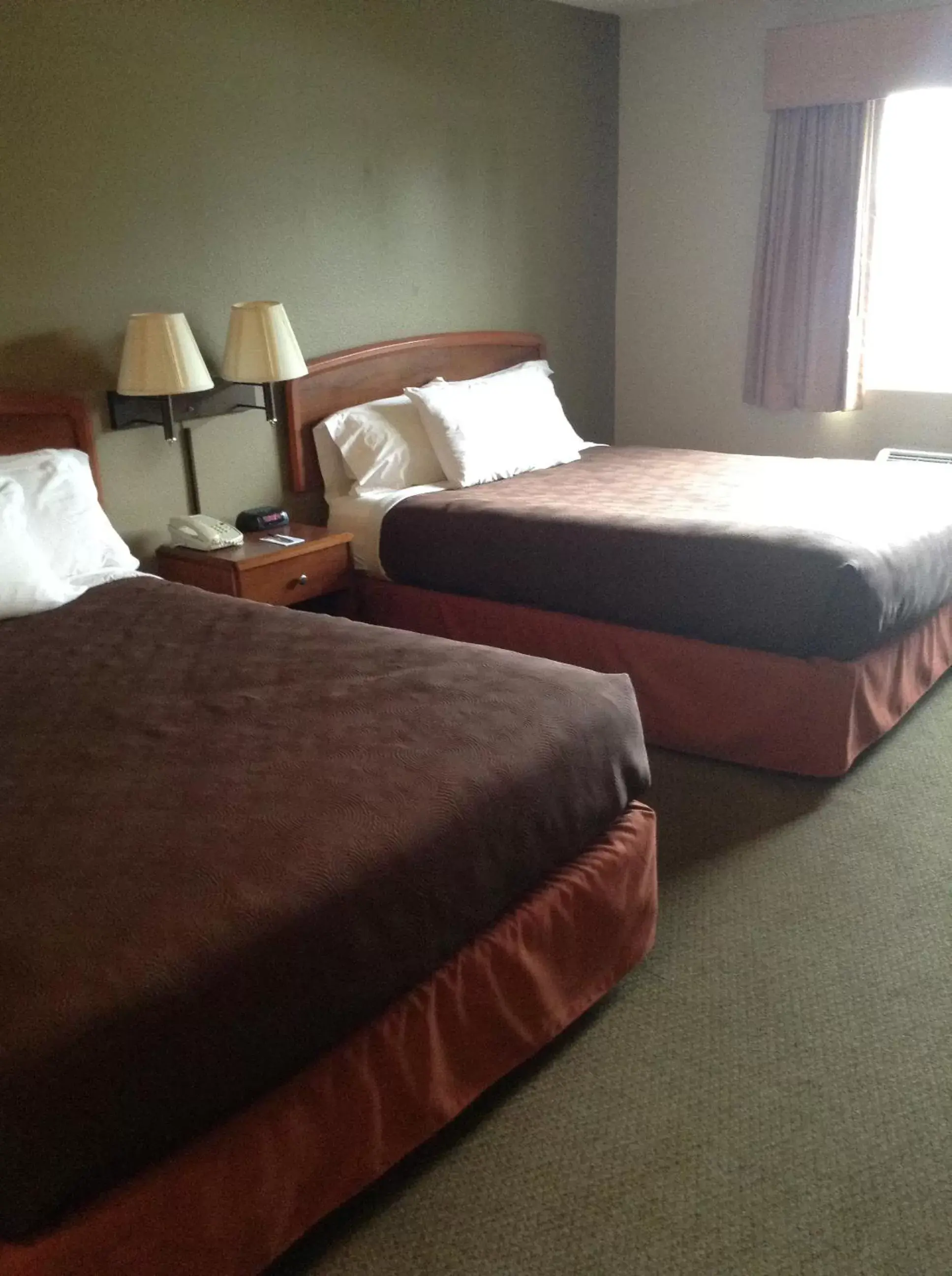 Bed in AmericInn by Wyndham Republic