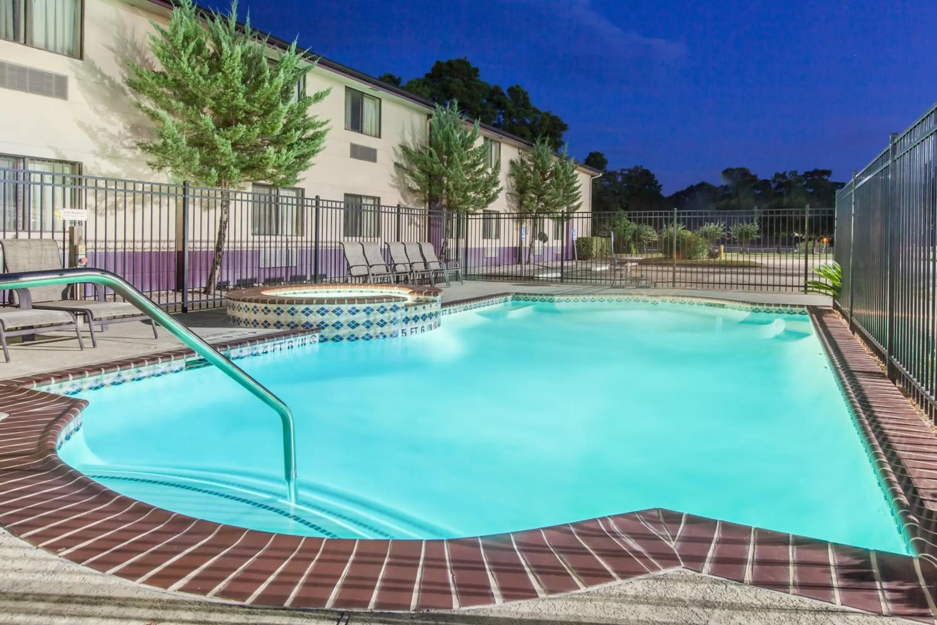 Property building, Swimming Pool in Super 8 by Wyndham Cleveland TX
