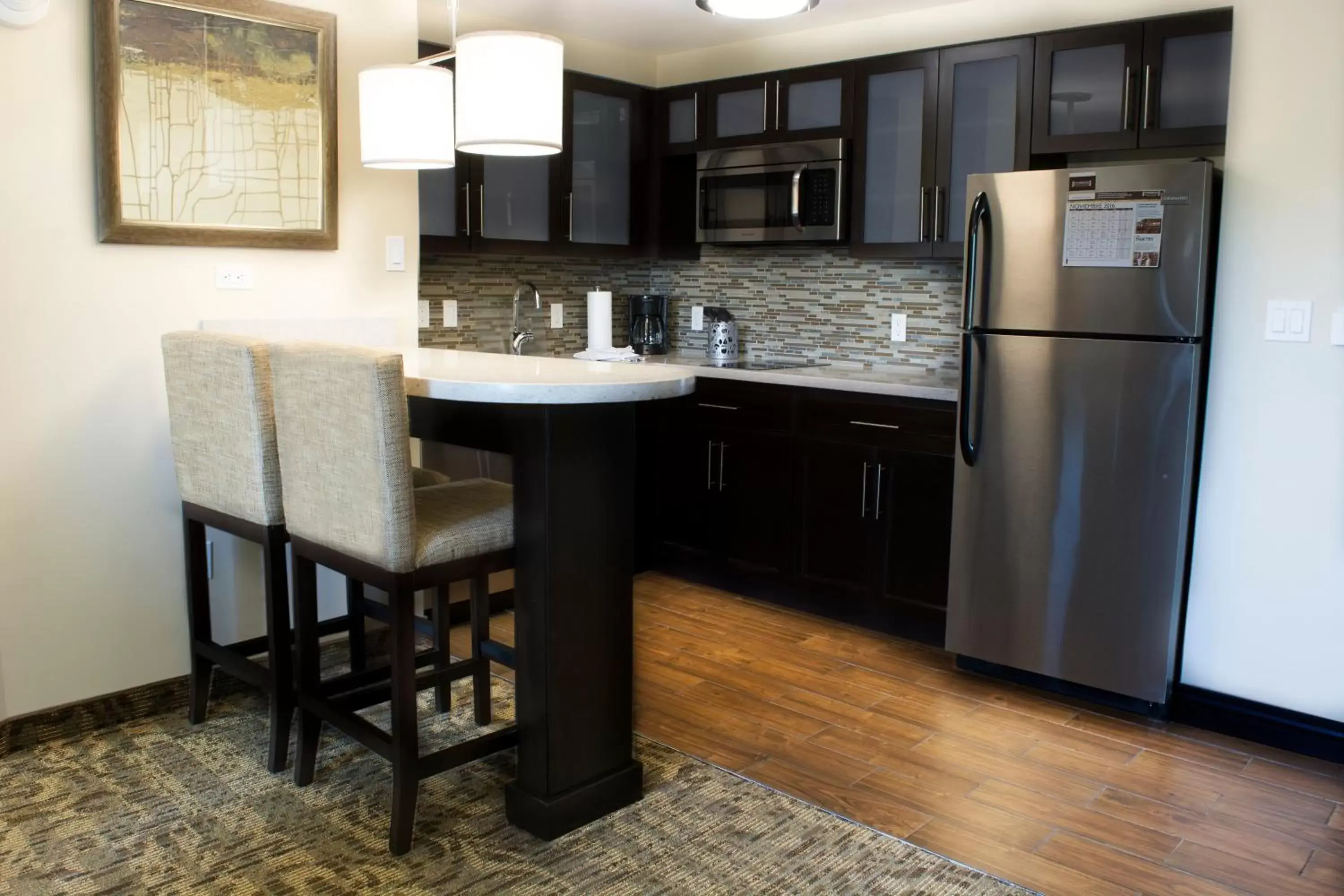 Photo of the whole room, Kitchen/Kitchenette in Staybridge Suites Chihuahua, an IHG Hotel