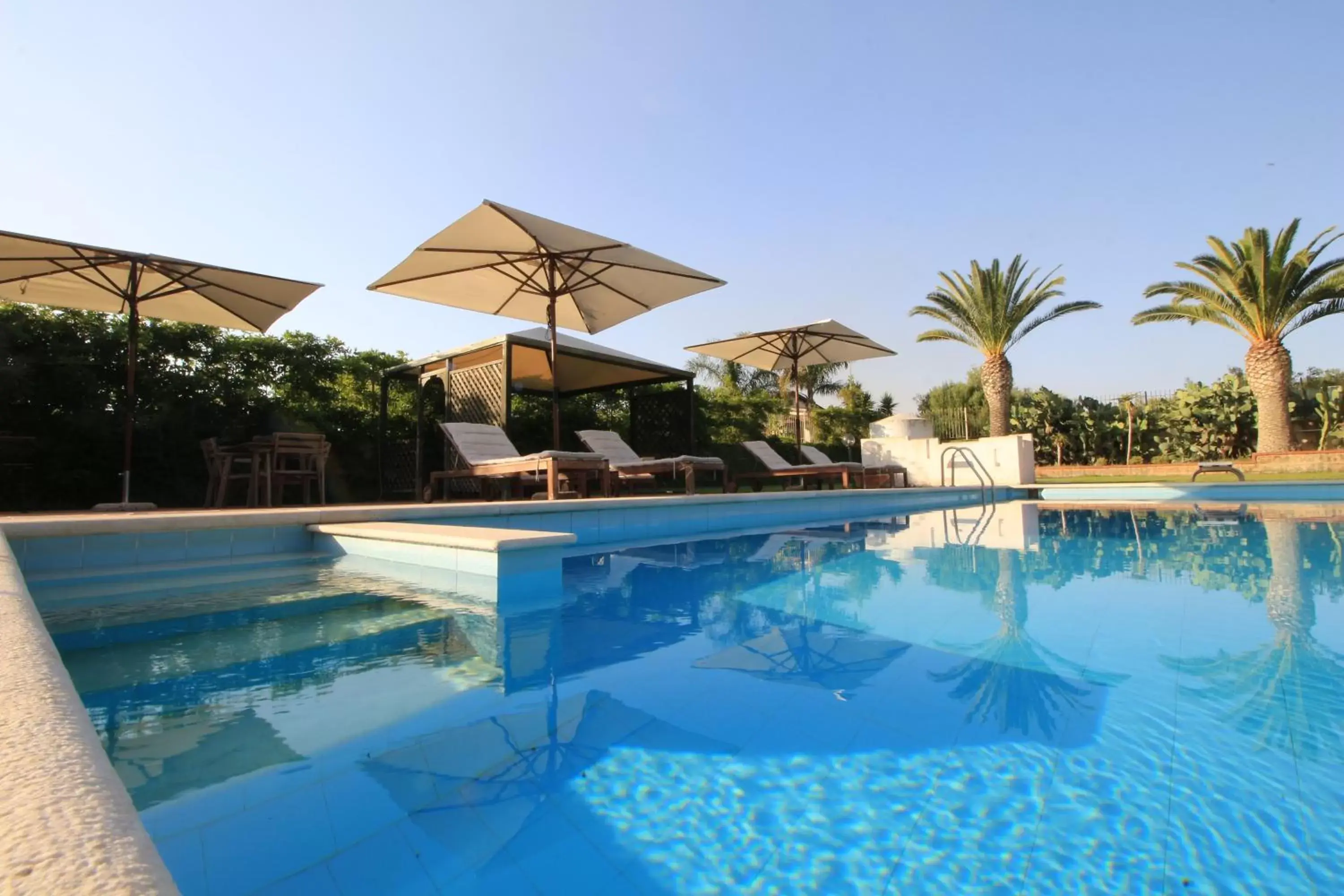 Swimming pool, Property Building in Villa Carlotta Resort