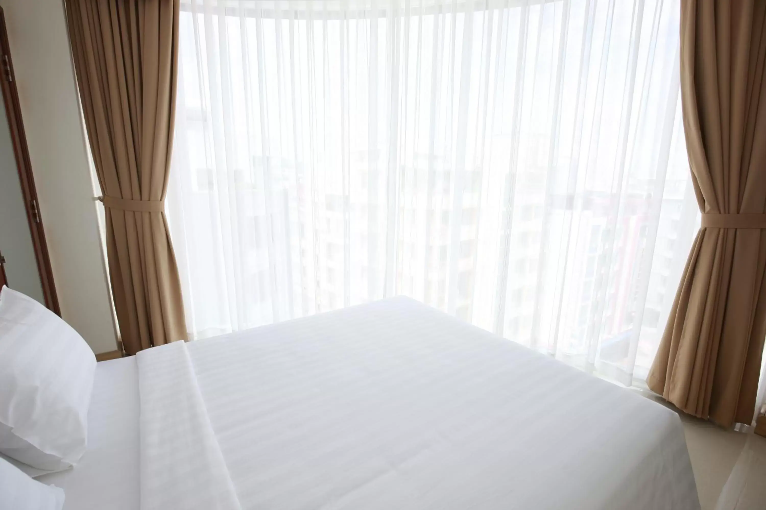 Bed in BELLA VT HOTEL