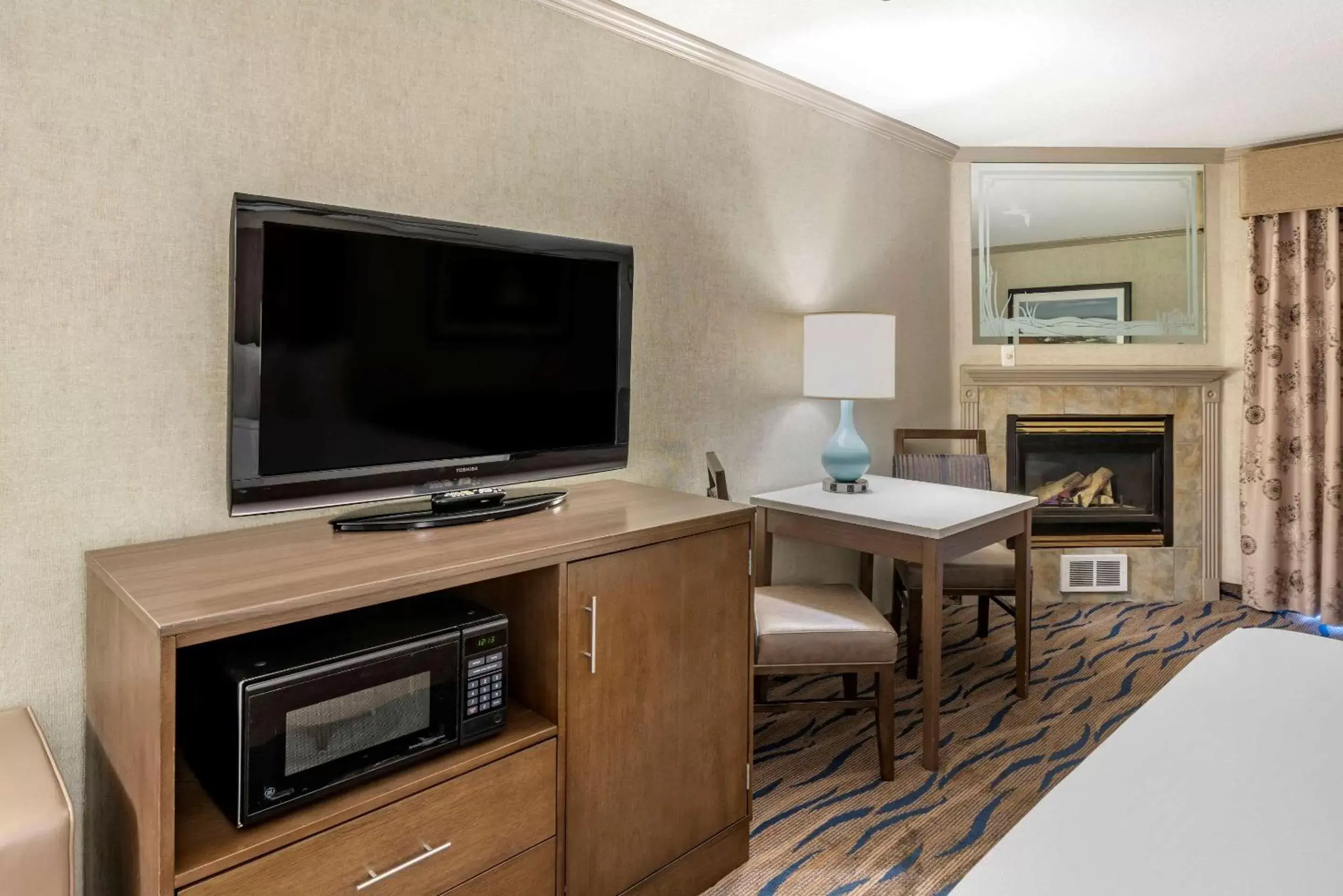 Photo of the whole room, TV/Entertainment Center in Elizabeth Oceanfront Suites, Ascend Hotel Collection