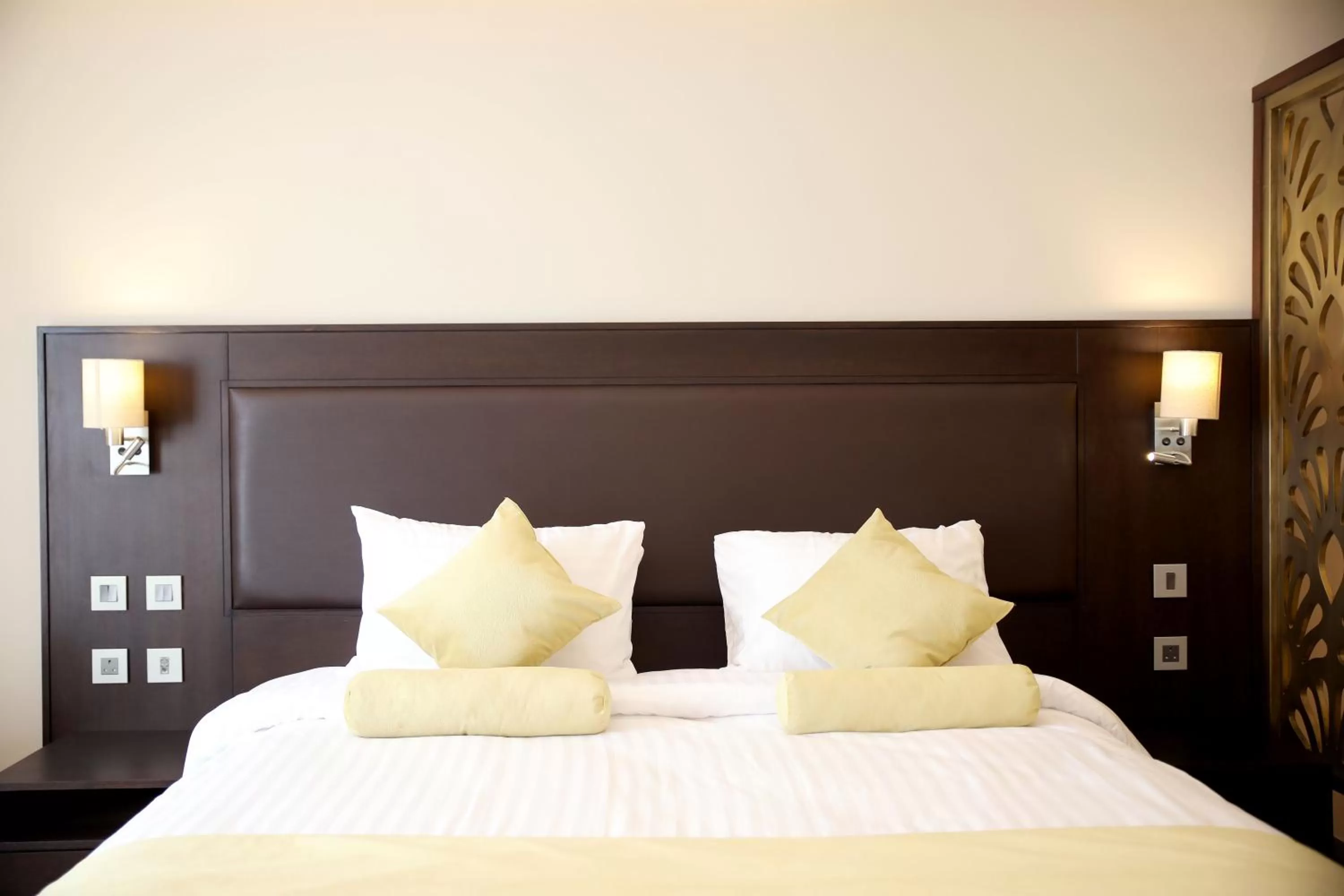 Bed in Downtown Hotel Apartments