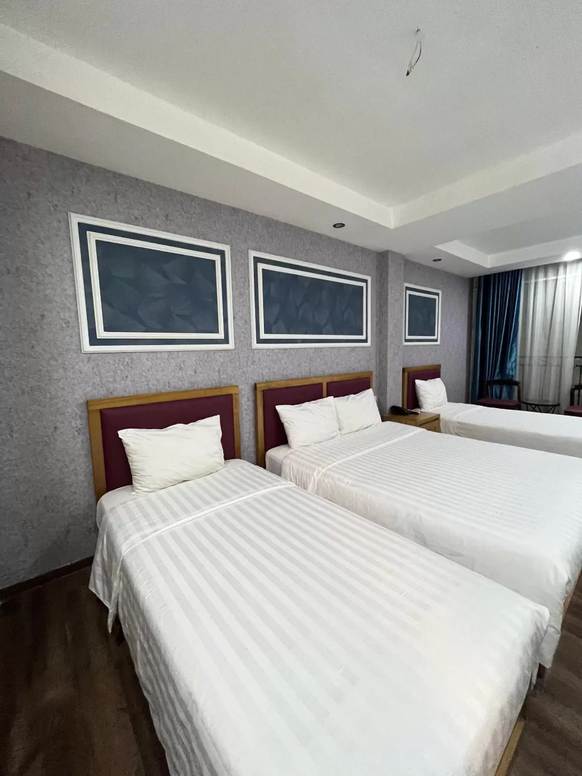 Bed in Holiday Suites Hotel & Spa